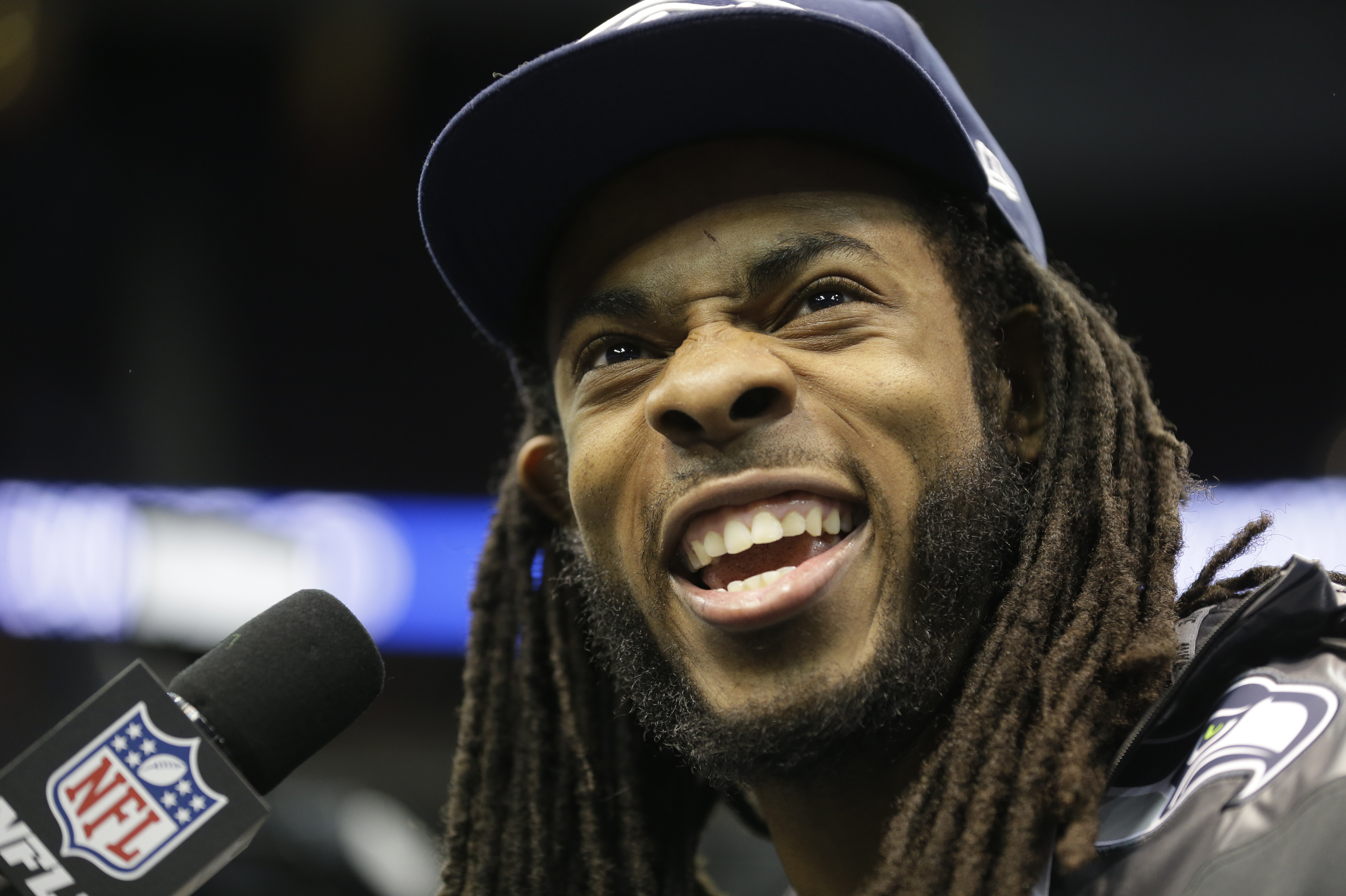 Seattle Seahawks' Richard Sherman answers a question during media day for the NFL Super Bowl XLVIII football game Tuesday, Jan. 28, 2014, in Newark, N.J. (AP Photo/Jeff Roberson)