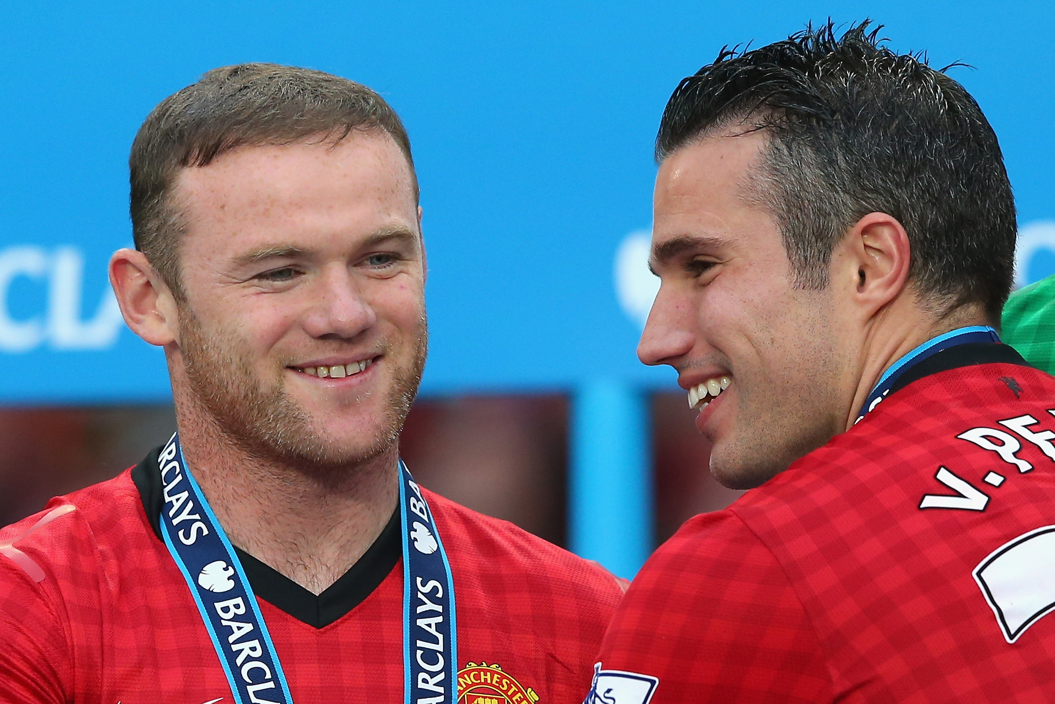 MANCHESTER, ENGLAND - MAY 12:  Wayne Rooney of Manchester United celebrates with team-mate Robin van Persie following the Barclays Premier League match between Manchester United and Swansea City at Old Trafford on May 12, 2013 in Manchester, England.  (Photo by Alex Livesey/Getty Images)