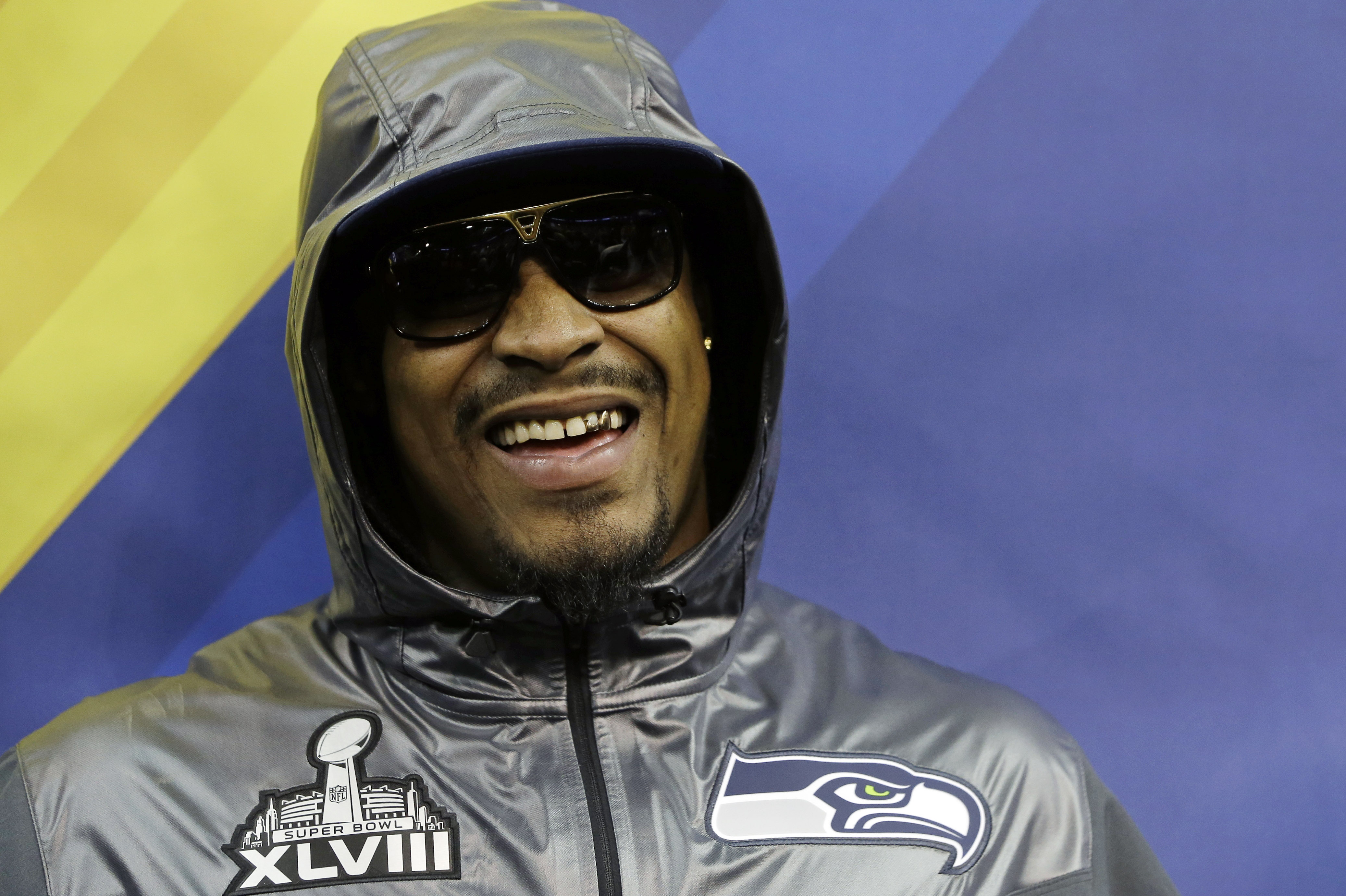 Seattle Seahawks' Marshawn Lynch smiles during media day for the NFL Super Bowl XLVIII football game Tuesday, Jan. 28, 2014, in Newark, N.J. (AP Photo/Mark Humphrey)