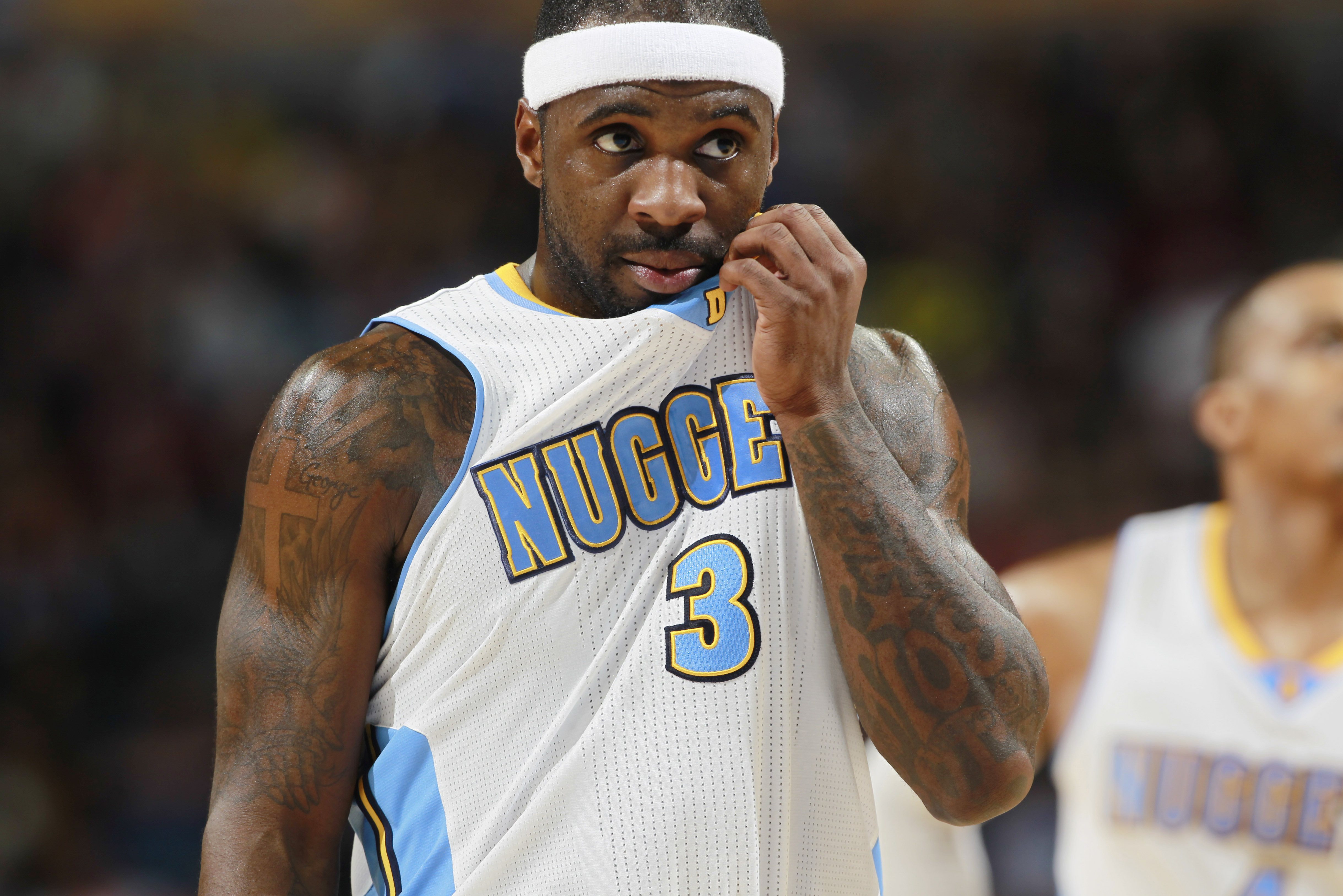 Denver Nuggets guard Ty Lawson waits to take foul shot against the Cleveland Cavaliers in the third quarter of the Cavaliers' 117-109 victory in an NBA basketball game in Denver on Friday, Jan. 17, 2014. (AP Photo/David Zalubowski)