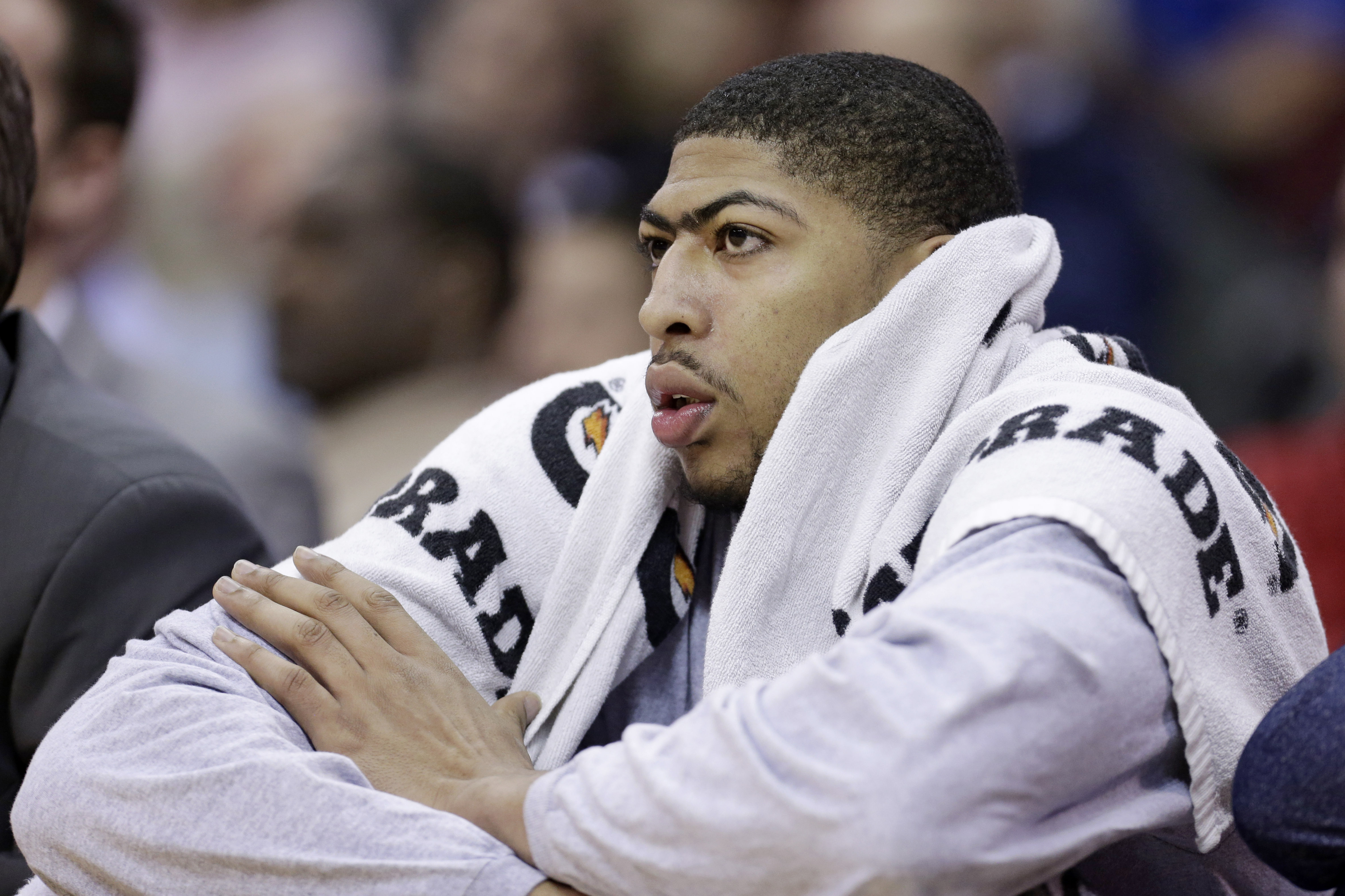 New Orleans Pelicans' Anthony Davis watches from the bench during the second quarter of an NBA basketball game against the Cleveland Cavaliers Tuesday, Jan. 28, 2014, in Cleveland. (AP Photo/Tony Dejak)