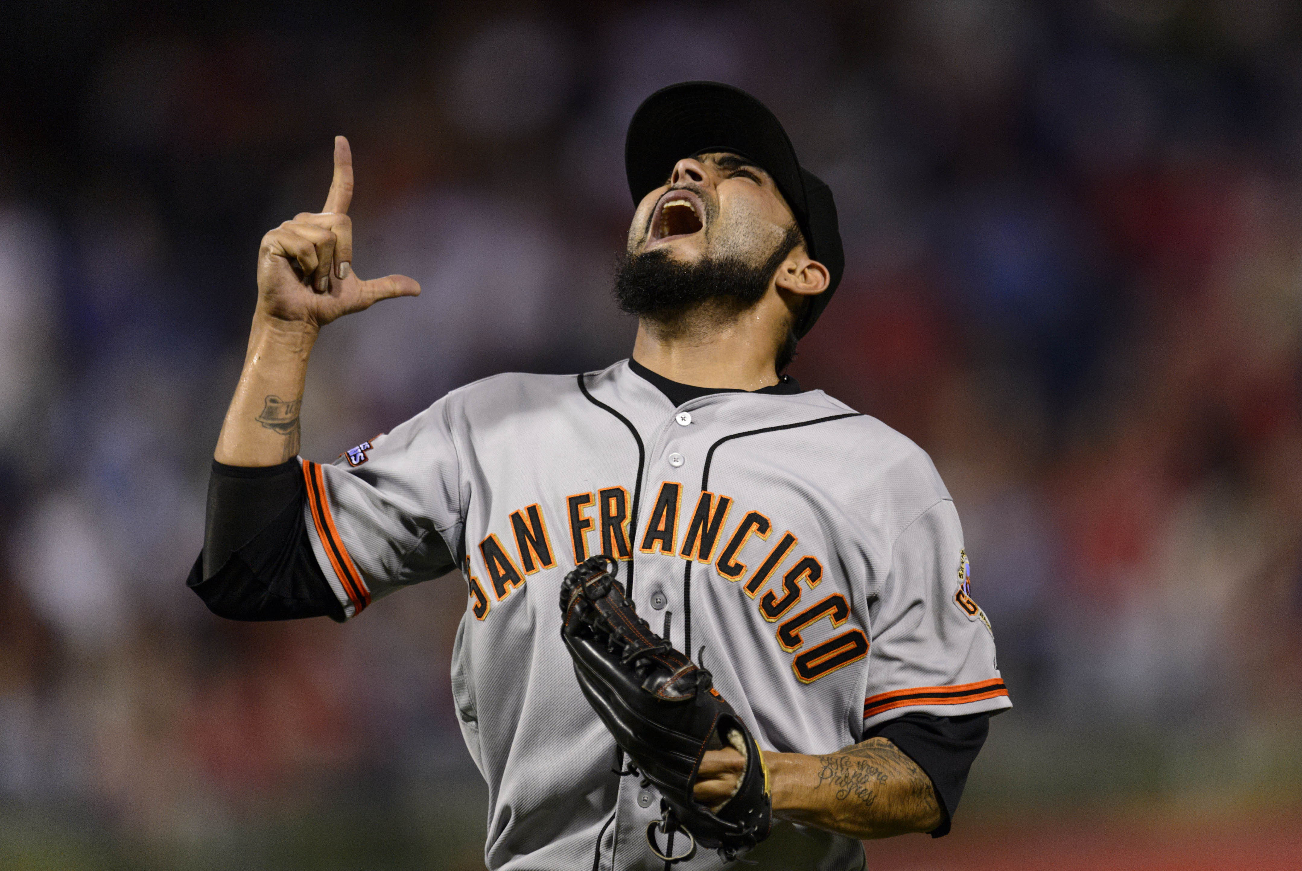 Aug 1, 2013; Philadelphia, PA, USA; San Francisco Giants pitcher Sergio Romo (54) reacts after getting the last out in the ninth inning against the Philadelphia Phillies at Citizens Bank Park. The Giants defeated the Phillies 2-1. Mandatory Credit: Howard Smith-USA TODAY Sports