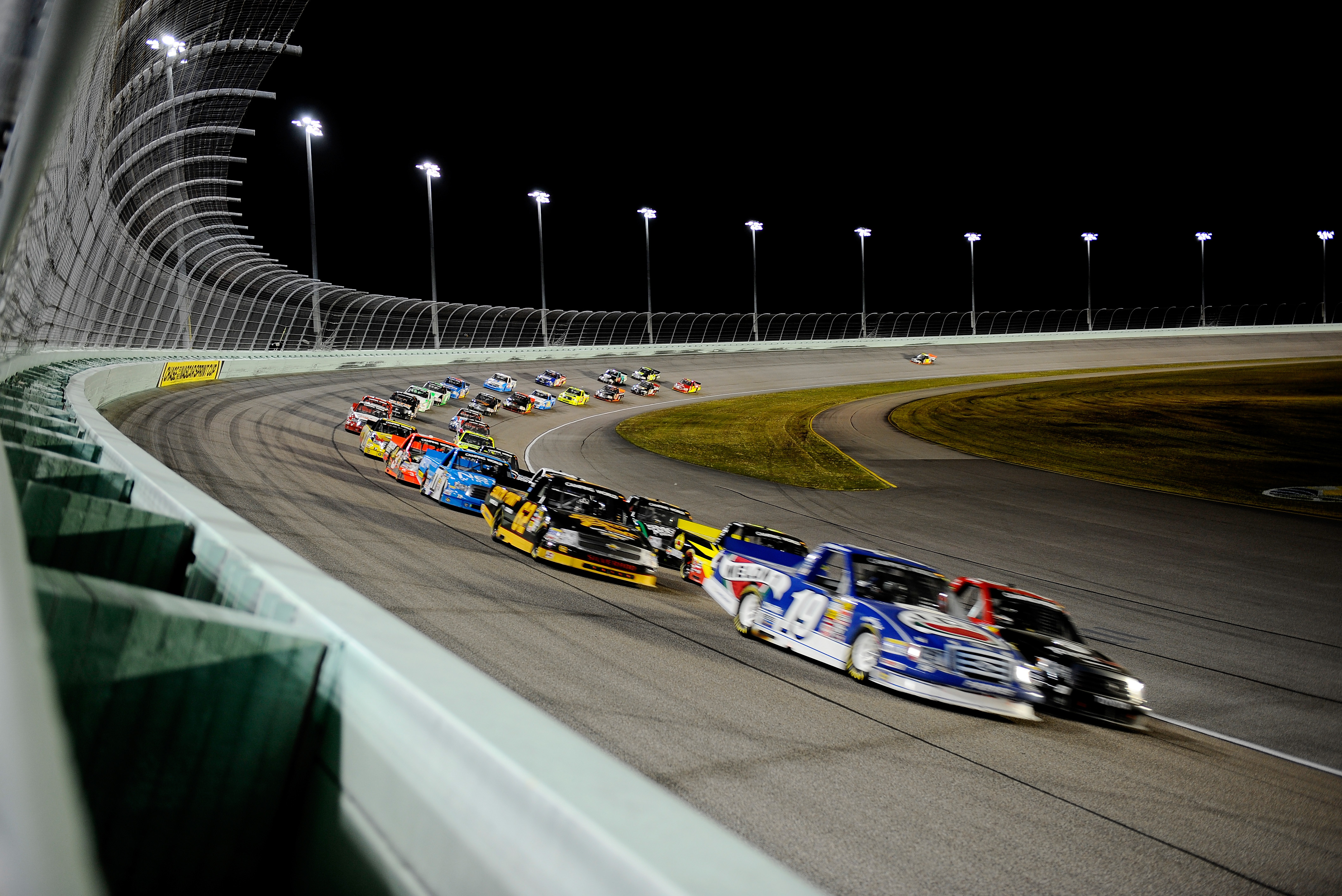 HOMESTEAD, FL - NOVEMBER 15:  Trucks race during the NASCAR Camping World Truck Series Ford EcoBoost 200 at Homestead-Miami Speedway on November 15, 2013 in Homestead, Florida.  (Photo by Jared C. Tilton/Getty Images)