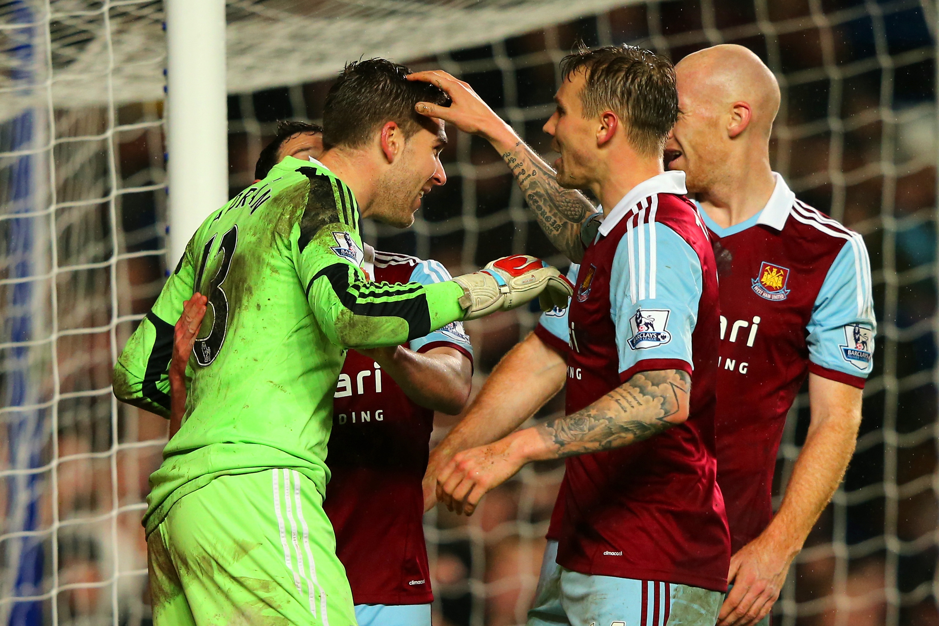 LONDON, ENGLAND - JANUARY 29:  Goalkeeper Adrian of West Ham celebrates with team mated during the Barclays Premier League match between Chelsea and West Ham United at Stamford Bridge on January 29, 2014 in London, England.  (Photo by Ian Walton/Getty Images)