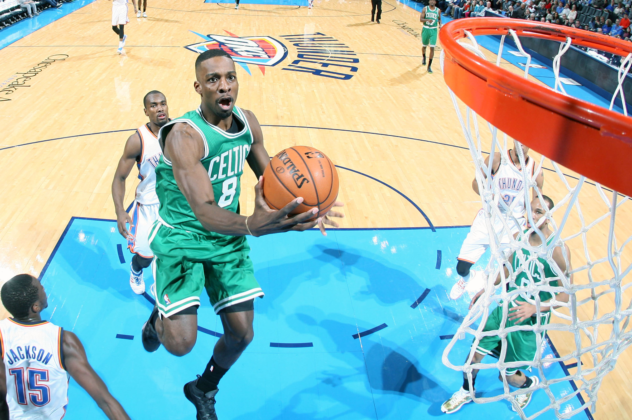 OKLAHOMA CITY, OK - JANUARY 5:  Jeff Green #8 of the Boston Celtics drives to the basket against the Oklahoma City Thunder on January 5, 2014 at the Chesapeake Energy Arena in Oklahoma City, Oklahoma. NOTE TO USER: User expressly acknowledges and agrees that, by downloading and or using this Photograph, user is consenting to the terms and conditions of the Getty Images License Agreement. Mandatory Copyright Notice: Copyright 2014 NBAE (Photo by Layne Murdoch Jr./NBAE via Getty Images)