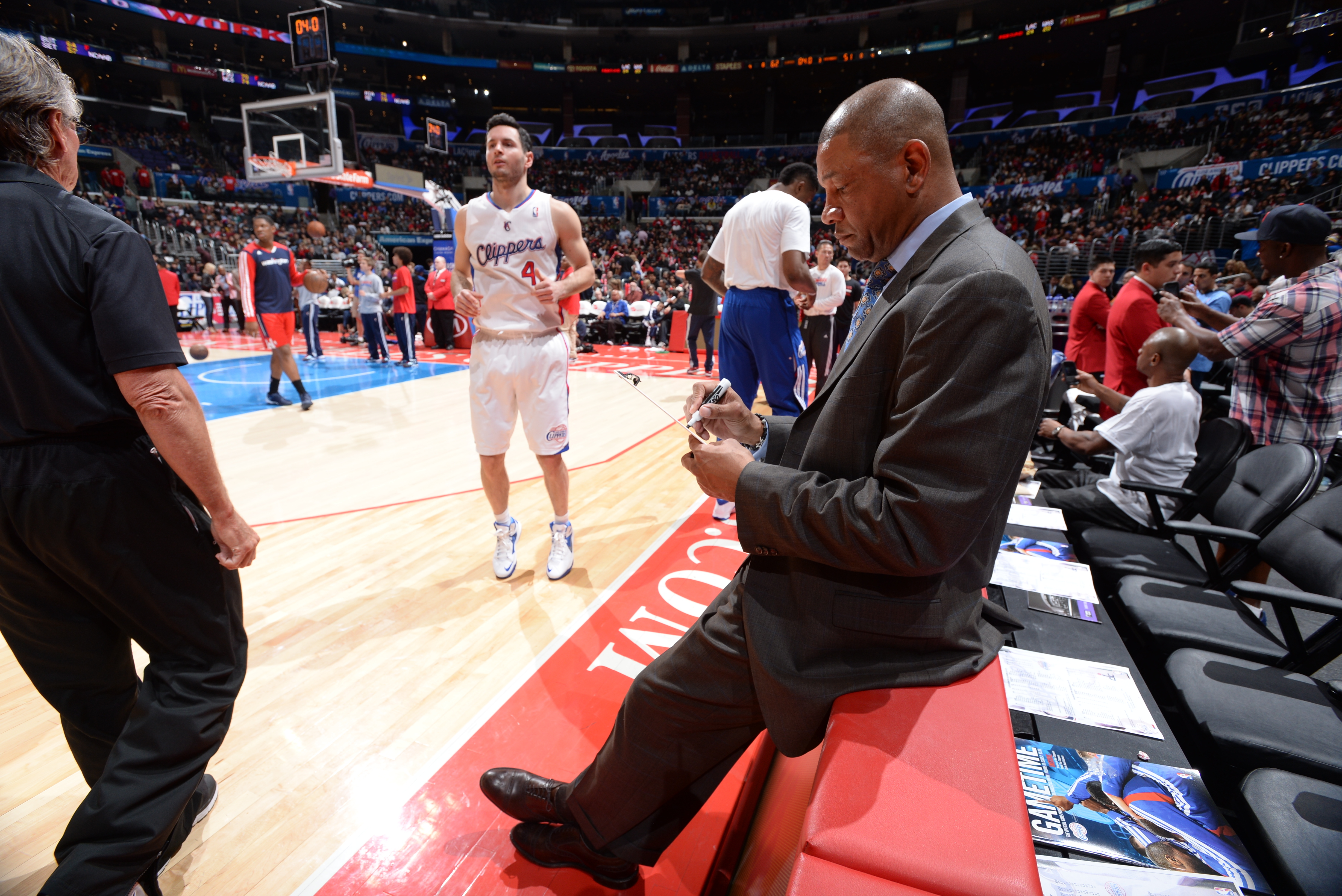 LOS ANGELES, CA - JANUARY 29: Doc Rivers of the Los Angeles Clippers draws up a play during a game against the Washington Wizards at STAPLES Center on January 29, 2014 in Los Angeles, California. NOTE TO USER: User expressly acknowledges and agrees that, by downloading and/or using this Photograph, user is consenting to the terms and conditions of the Getty Images License Agreement. Mandatory Copyright Notice: Copyright 2014 NBAE (Photo by Andrew D. Bernstein/NBAE via Getty Images)