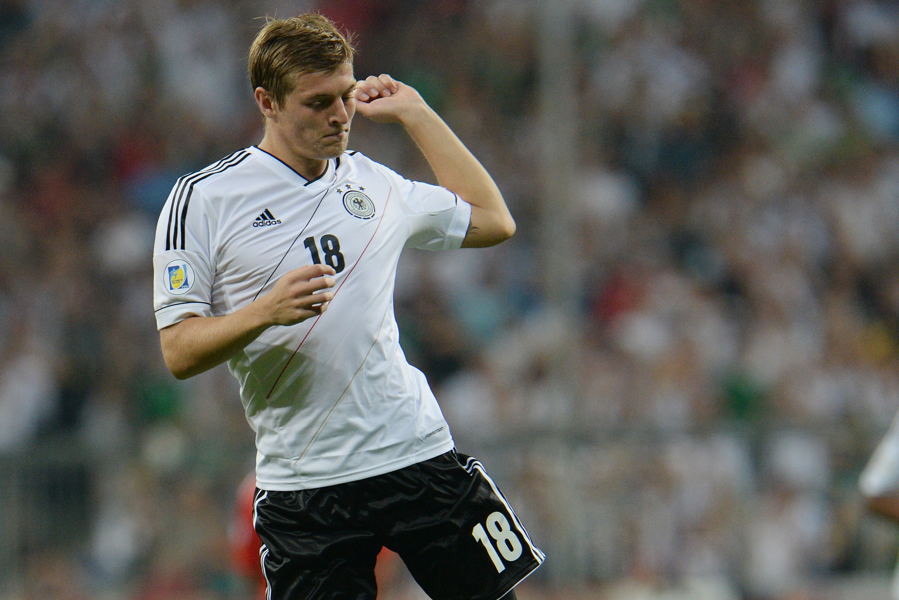 Germany's Toni Kroos celebrates after scoring during the FIFA World Cup 2014 qualification group C soccer match between Germany and Austria in Munich, southern Germany, on Friday, Sept.6, 2013. (AP Photo/ Kerstin Joensson)