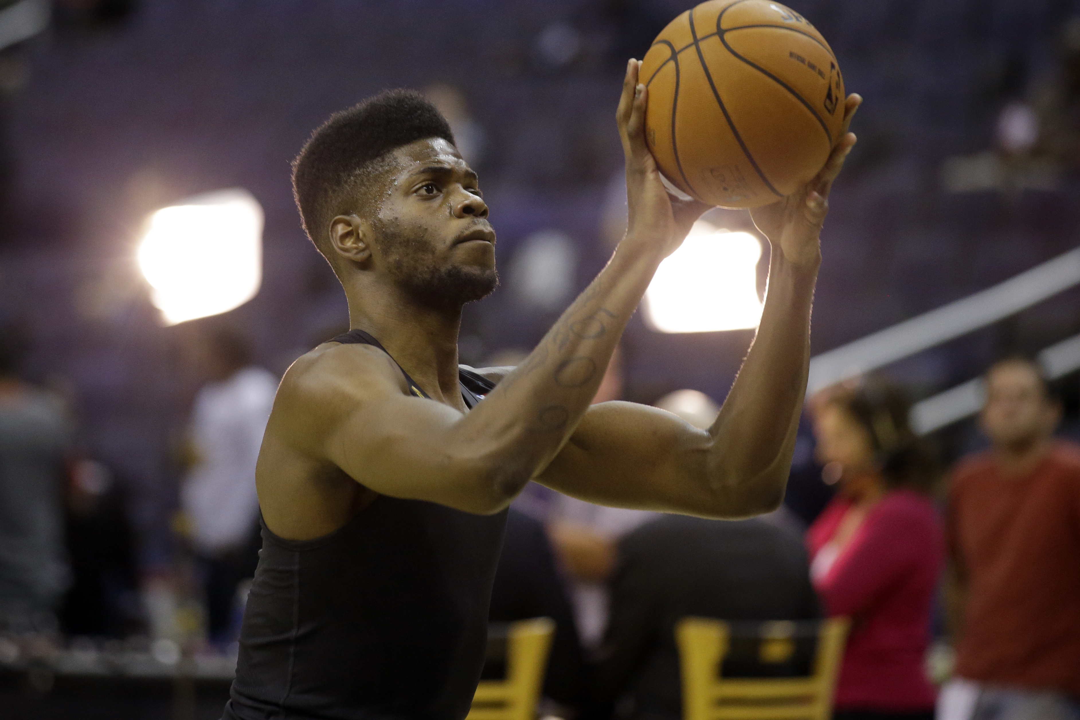 Philadelphia 76ers center Nerlens Noel (4) warms up before an NBA basketball game against the Washington Wizards, Friday, Nov. 1, 2013, in Washington. (AP Photo/Alex Brandon)