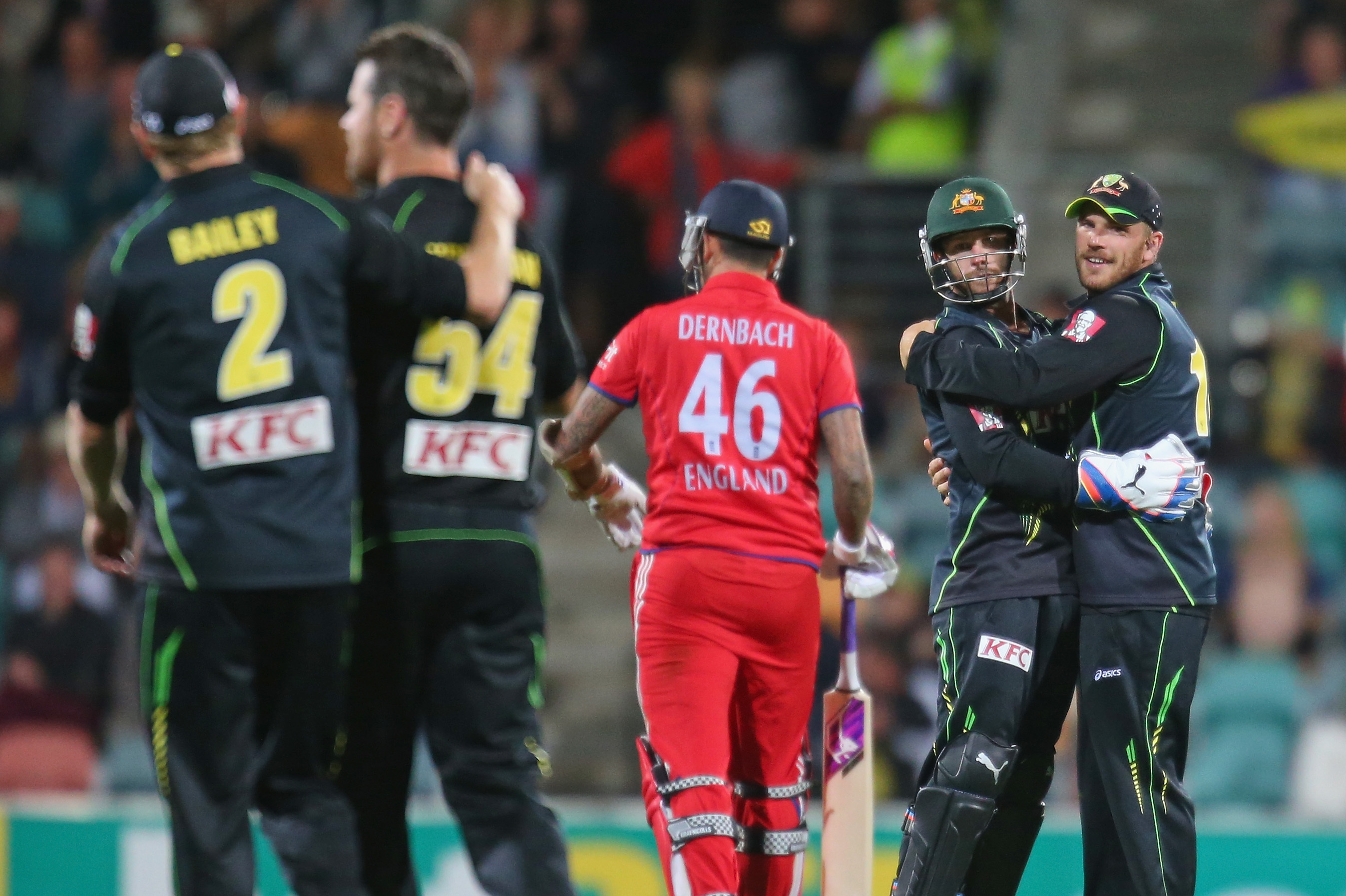 HOBART, AUSTRALIA - JANUARY 29:  Matthew Wade and Aaron Finch of Australia celebrate after the dismissal of Jade Dernbach of England during game one of the International Twenty20 series between Australia and England at Blundstone Arena on January 29, 2014 in Hobart, Australia.  (Photo by Scott Barbour/Getty Images)