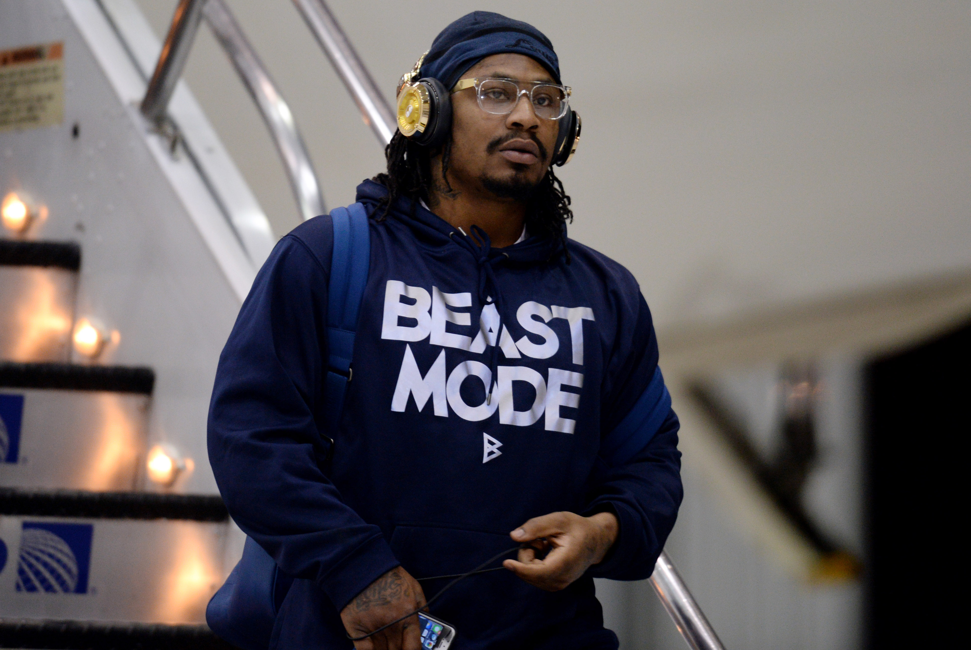 Jan 26, 2014; Newark, NJ, USA; Seattle Seahawks running back Marshawn Lynch arrives at Newark Liberty International Airport to face the Denver Broncos in Super Bowl XLVIII. Mandatory Credit: Joe Camporeale-USA TODAY Sports