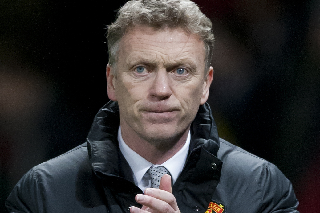 Manchester United's manager David Moyes applauds supporters after his team's 2-0 win against Cardiff City in their English Premier League soccer match at Old Trafford Stadium, Manchester, England, Tuesday Jan. 28, 2014. (AP Photo/Jon Super)