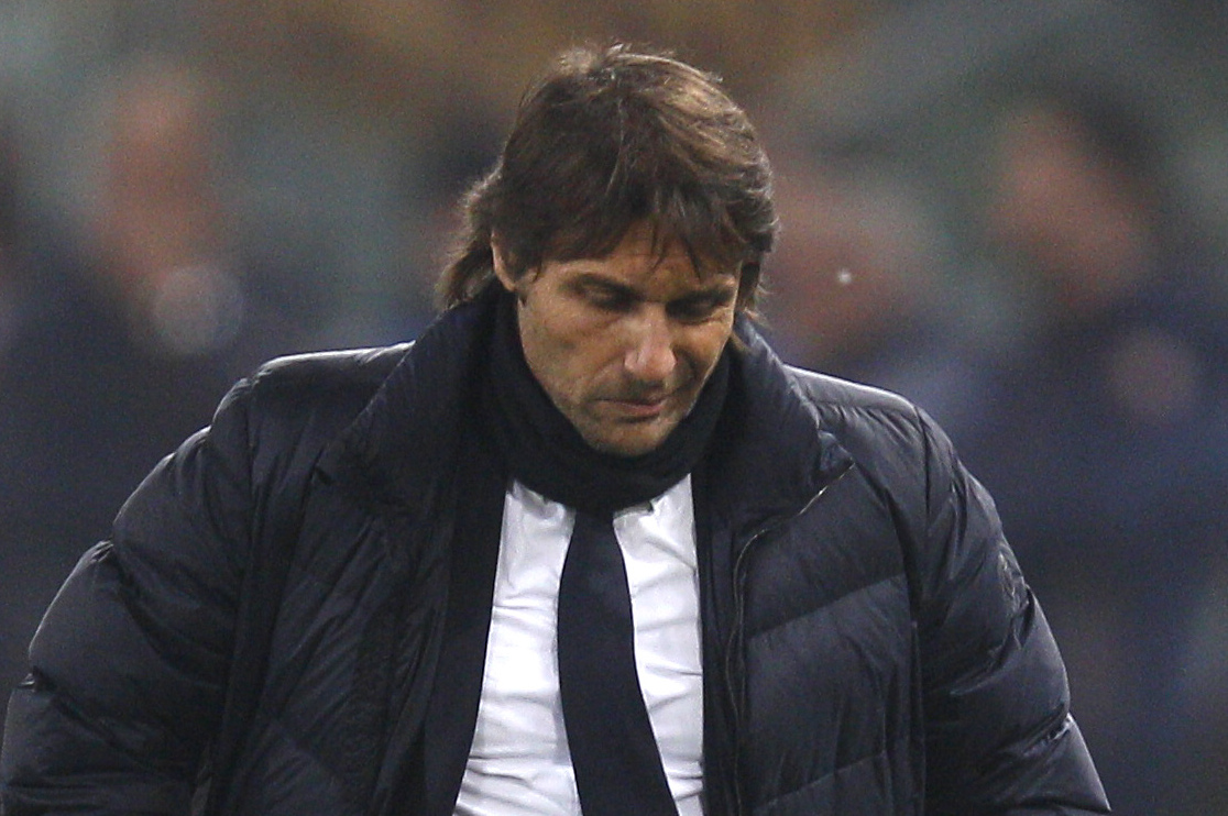 Juventus coach Antonio Conte looks down in the last minutes of an Italian Cup, round of eight, soccer match, between AS Roma and Juventus at Rome's Olympic stadium, Tuesday, Jan. 21, 2014. AS Roma beat Juventus 1-0. (AP Photo/Alessandra Tarantino)