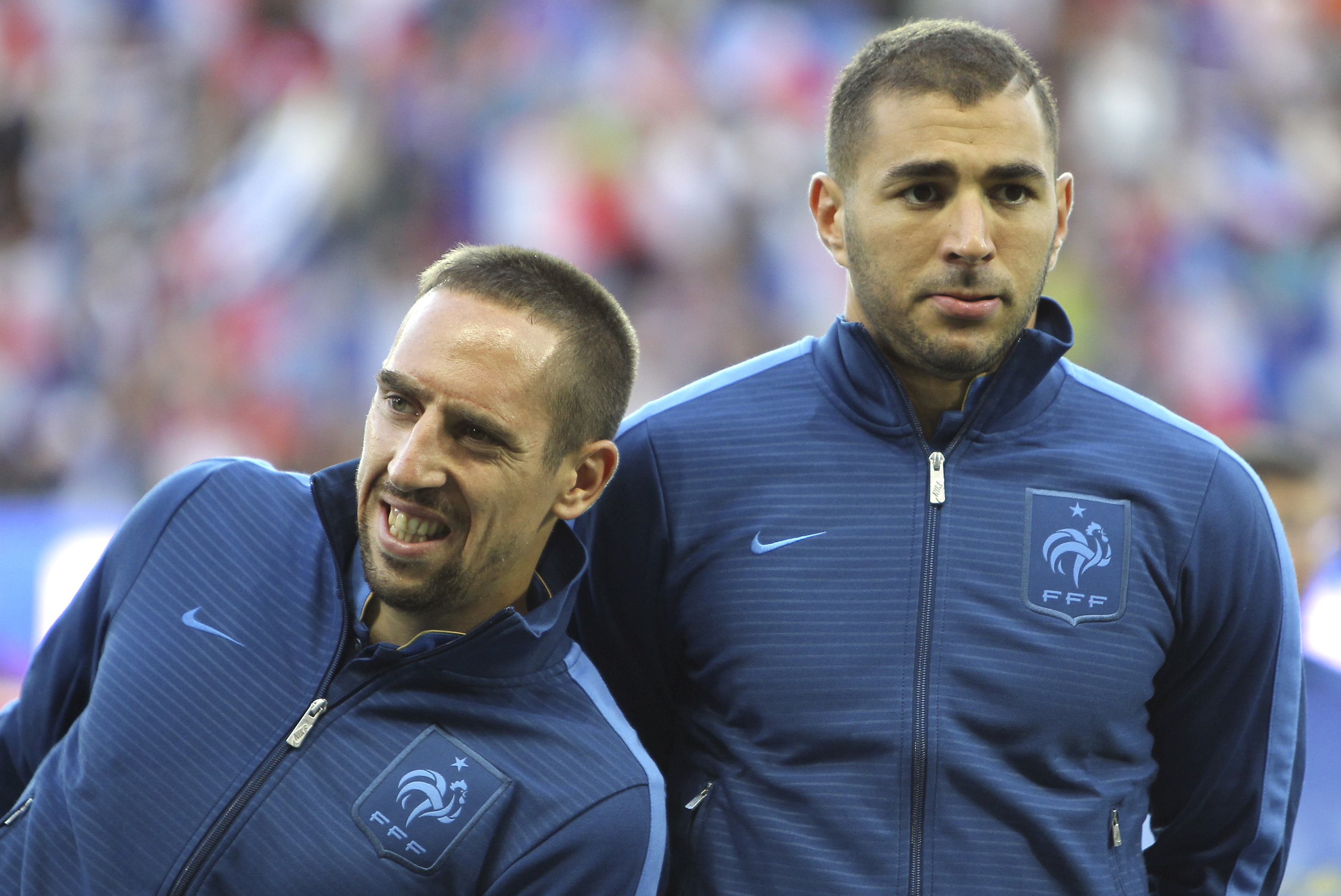 FILE - In this Aug.15, 2012 file photo, French forwards Franck Ribery, left, and Karim Benzema, are seen prior to their friendly soccer match against Uruguay, in Le Havre, north western France. Bayern Munich winger Franck Ribery and Real Madrid forward Karim Benzema have been acquitted on charges of soliciting an underage prostitute as the judge ruled Thursday, Jan.30, 2014 there wasn't enough proof the men were aware that self-described escort Zahia Dehar, now 21, was a minor at the time. (AP Photo/David Vincent, File)