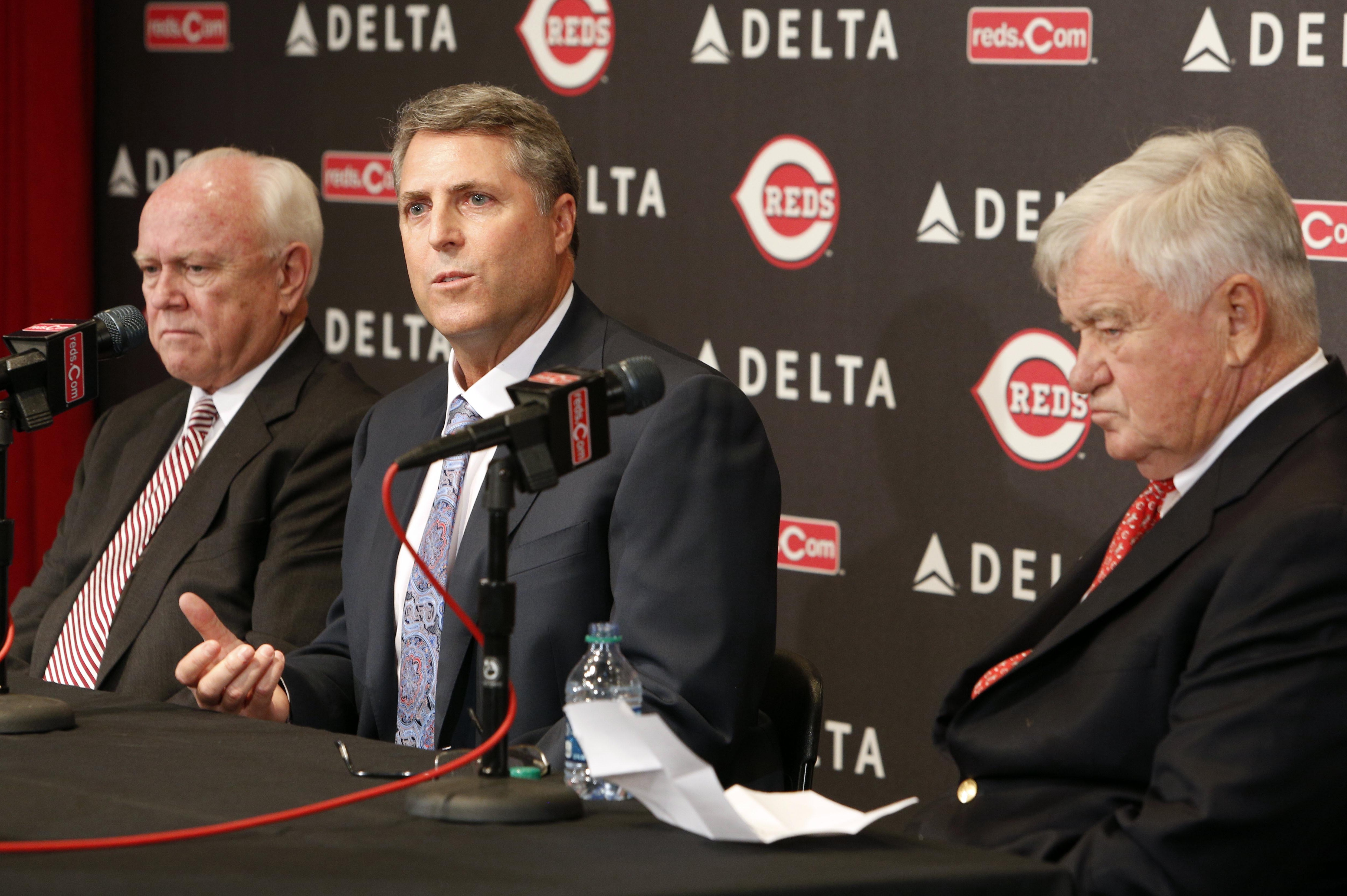 Oct 22, 2013; Cincinnati, OH, USA; Cincinnati Reds new manager Bryan Price (middle) speaks with general manager Walt Jocketty (left) and president Bob Castellini during a news conference at Great American Ballpark. Mandatory Credit: David Kohl-USA TODAY Sports