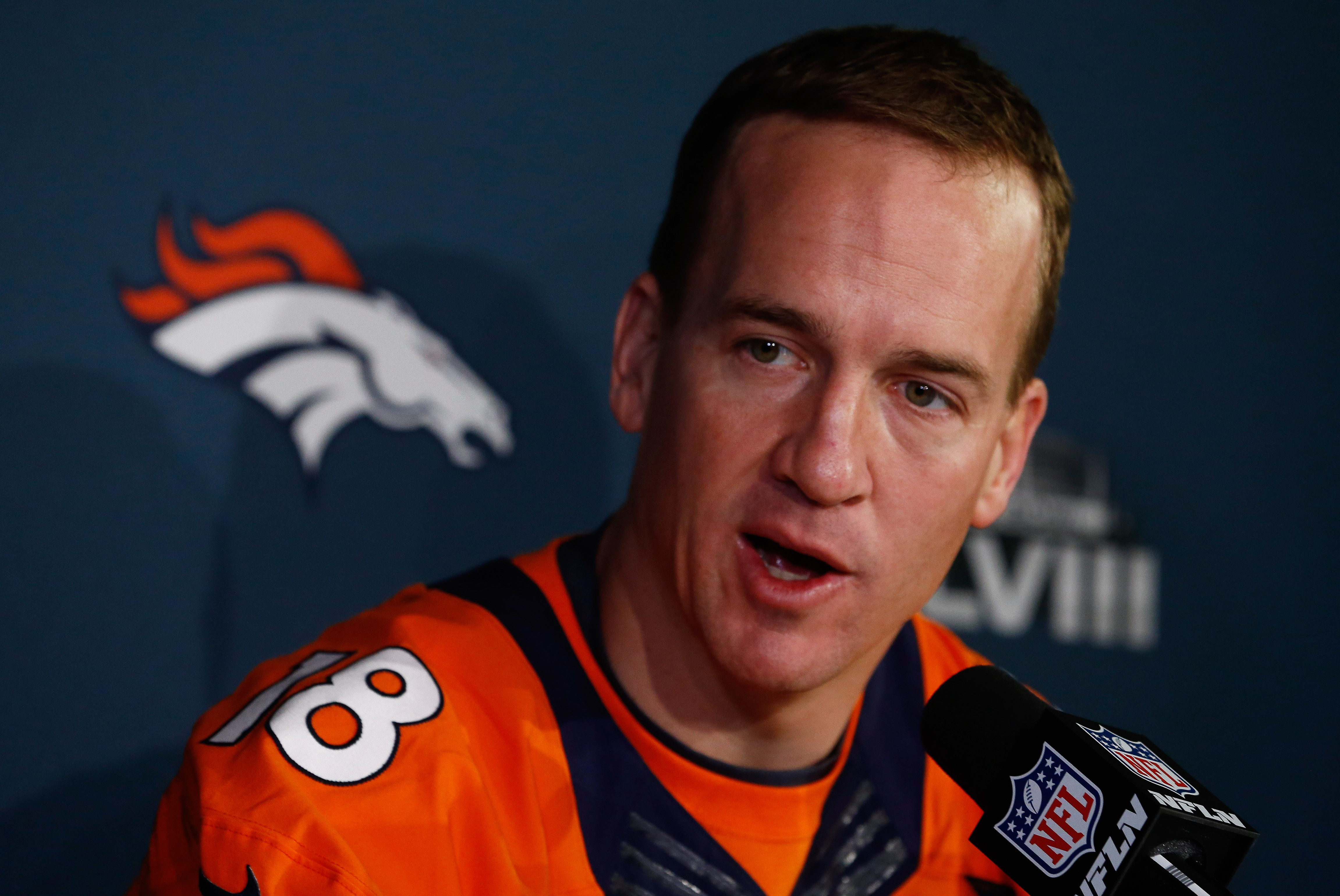JERSEY CITY, NJ - JANUARY 29:    Peyton Manning #18 of the Denver Broncos speaks to the media during an availability January 29, 2014 in Jersey City, New Jersey. The Denver Broncos and Seattle Seahawks will meet at Super Bowl XLVIII at Metlife Stadium on February 2, 2014. (Photo by Jeff Zelevansky/Getty Images)