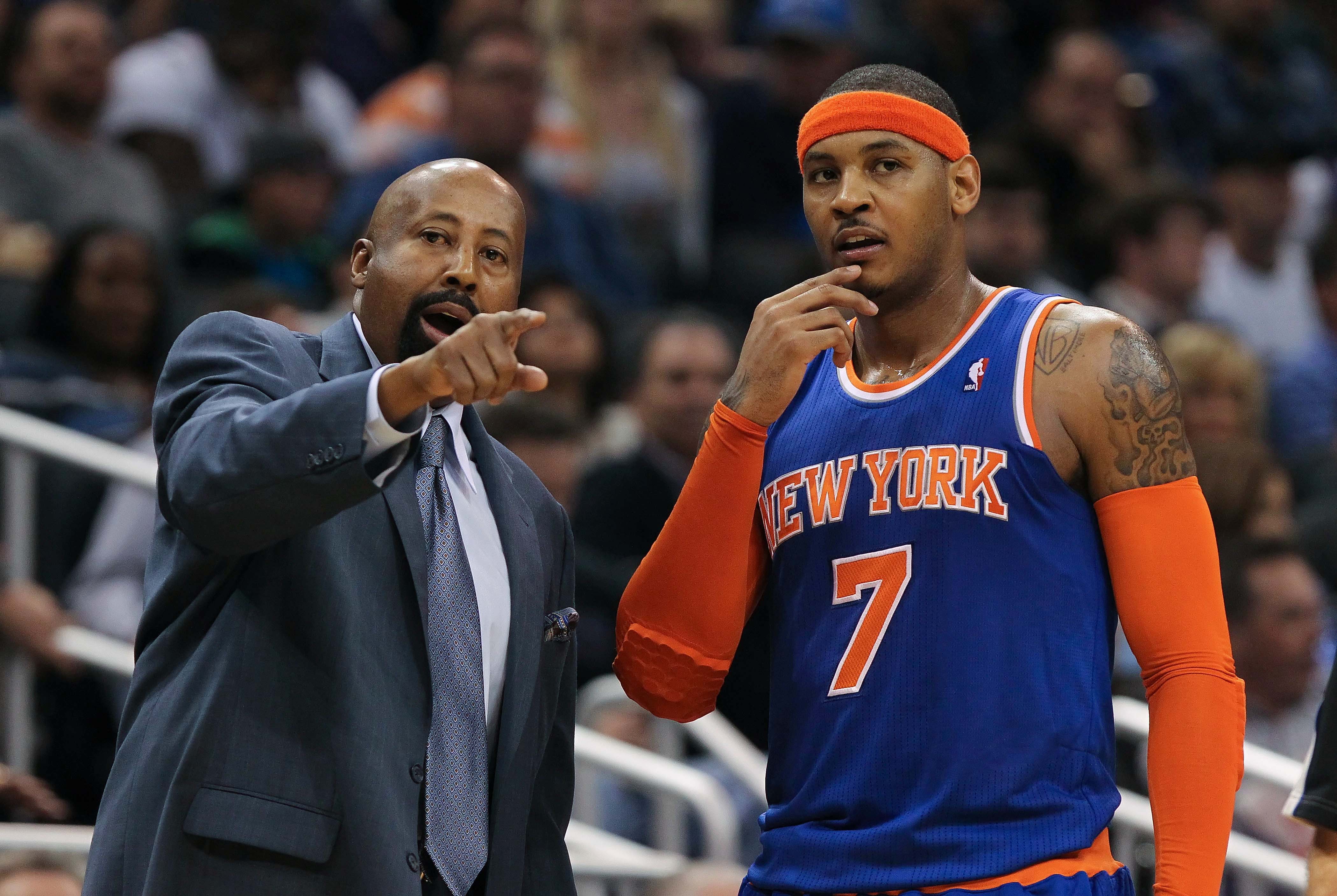 January 5, 2013; Orlando FL, USA; New York Knicks head coach Mike Woodson talks with small forward Carmelo Anthony (7) during the second quarter at Amway Center. Mandatory Credit: Kim Klement-USA TODAY Sports