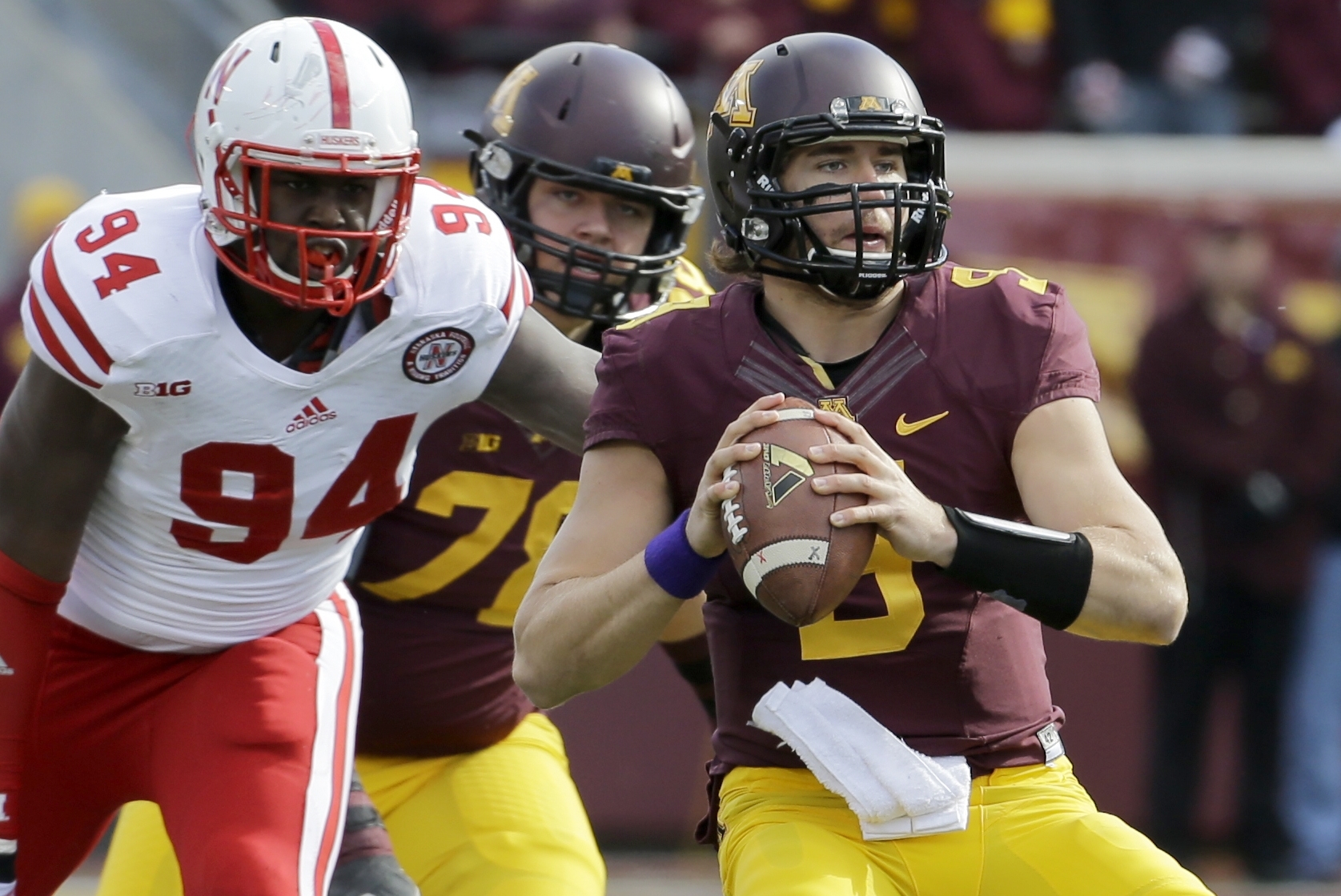 FILE - In this Oct. 26, 2013, file photo, Minnesota quarterback Philip Nelson drops back for a pass during an NCAA college football game against Nebraska in Minneapolis. Nelson and his Minnesota teammates face Syracuse in the Texas Bowl on Friday, Dec. 27, in Houston. (AP Photo/Ann Heisenfelt, File)