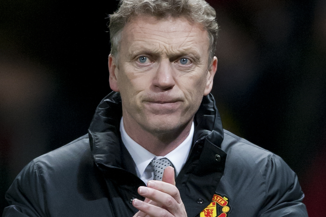 Manchester United's manager David Moyes applauds supporters after his team's 2-0 win against Cardiff City in their English Premier League soccer match at Old Trafford Stadium, Manchester, England, Tuesday Jan. 28, 2014. (AP Photo/Jon Super)