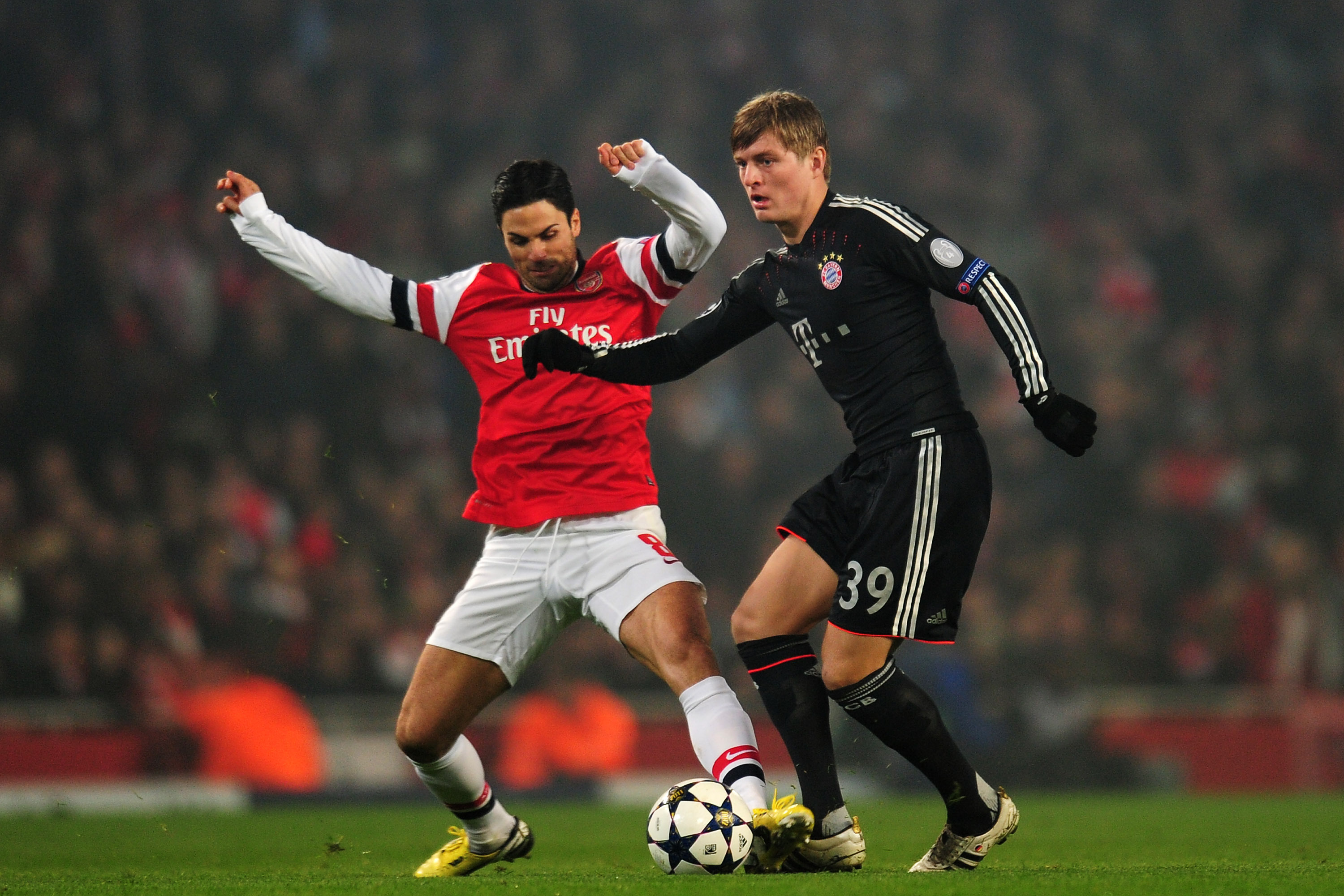 LONDON, ENGLAND - FEBRUARY 19:  Mikel Arteta of Arsenal in action against Toni Kroos of Bayern Muenchen during the UEFA Champions League round of 16 first leg match between Arsenal and Bayern Muenchen at Emirates Stadium on February 19, 2013 in London, England.  (Photo by Shaun Botterill/Getty Images)