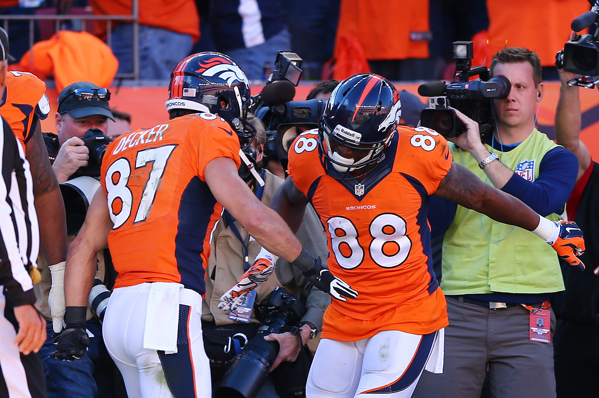 DENVER, CO - JANUARY 19:   Demaryius Thomas #88 celebrates his third quarter touchdown with  Eric Decker #87 of the Denver Broncos during the AFC Championship game against the New England Patriots at Sports Authority Field at Mile High on January 19, 2014 in Denver, Colorado.  (Photo by Elsa/Getty Images)