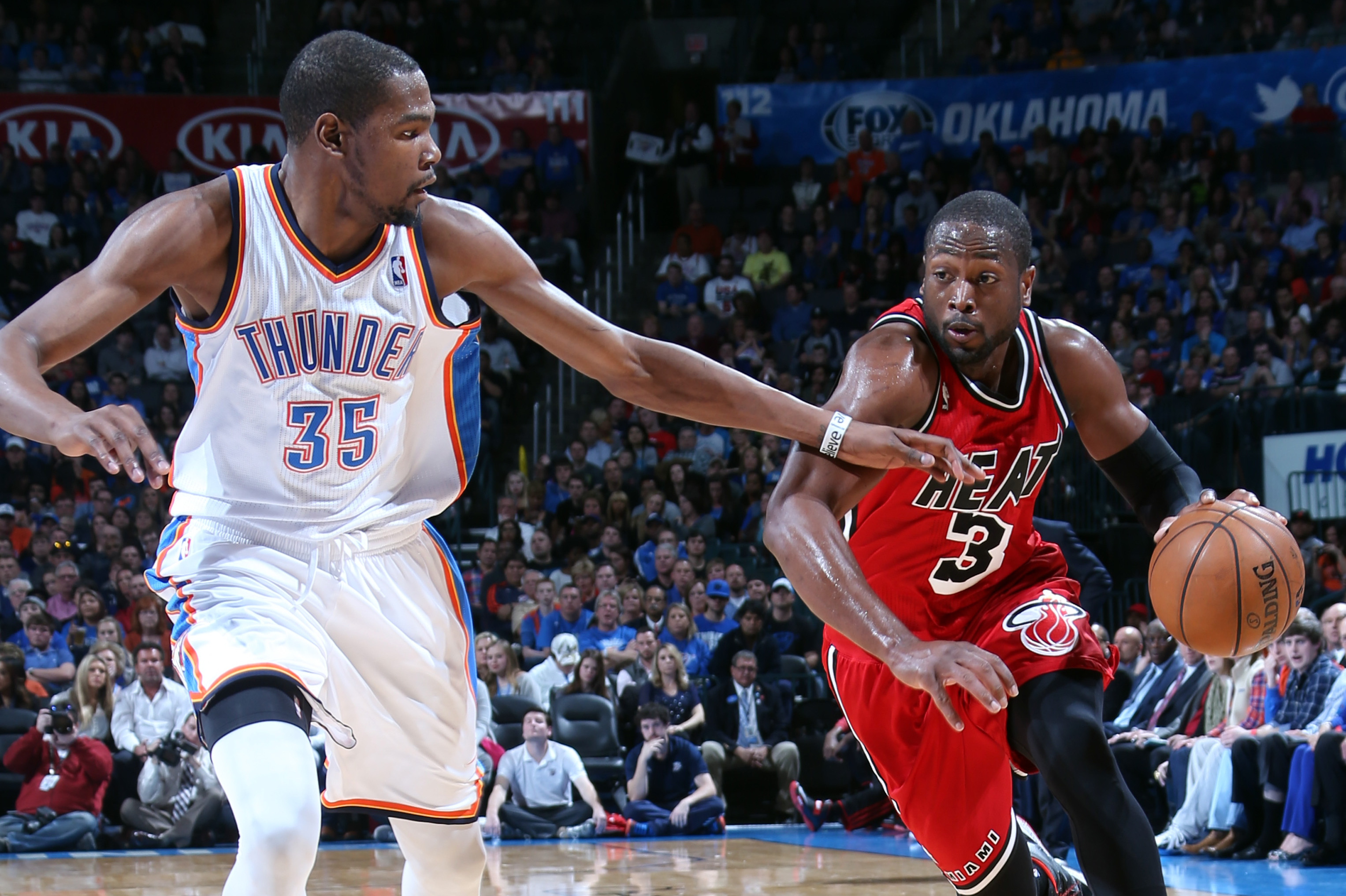 OKLAHOMA CITY, OK - FEBRUARY 14:  Dwyane Wade #3 of the Miami Heat drives to the basket against Kevin Durant #35 of the Oklahoma City Thunder during an NBA game on February 14, 2013 at the Chesapeake Energy Arena in Oklahoma City, Oklahoma. NOTE TO USER: User expressly acknowledges and agrees that, by downloading and or using this Photograph, user is consenting to the terms and conditions of the Getty Images License Agreement. Mandatory Copyright Notice: Copyright 2013 NBAE (Photo by Layne Murdoch/NBAE via Getty Images)