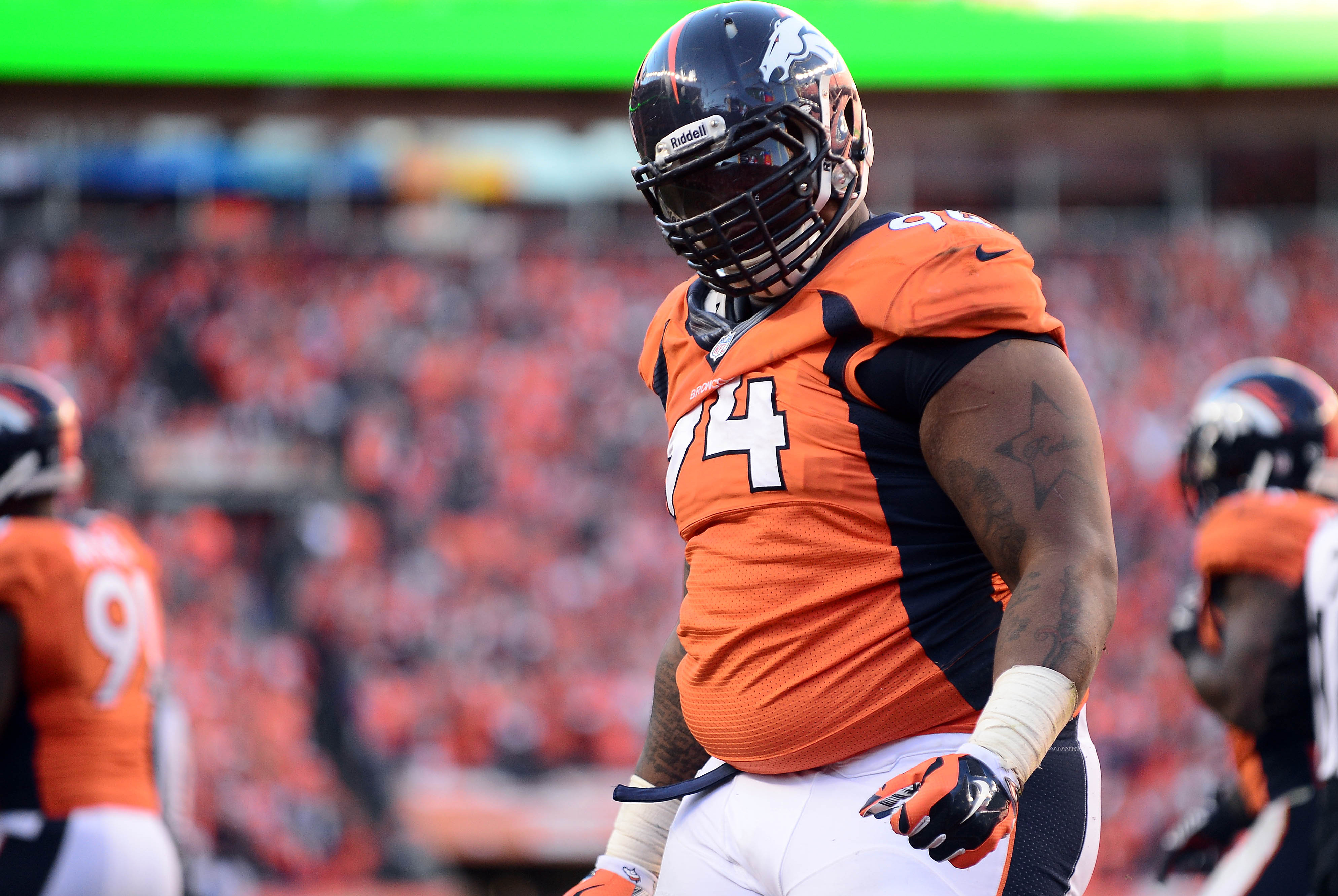 January 19, 2014; Denver, CO, USA; Denver Broncos defensive tackle Terrance Knighton (94) celebrates after sacking New England Patriots quarterback Tom Brady (12) in the second half of the 2013 AFC Championship football game at Sports Authority Field at Mile High.  Mandatory Credit: Ron Chenoy-USA TODAY Sports