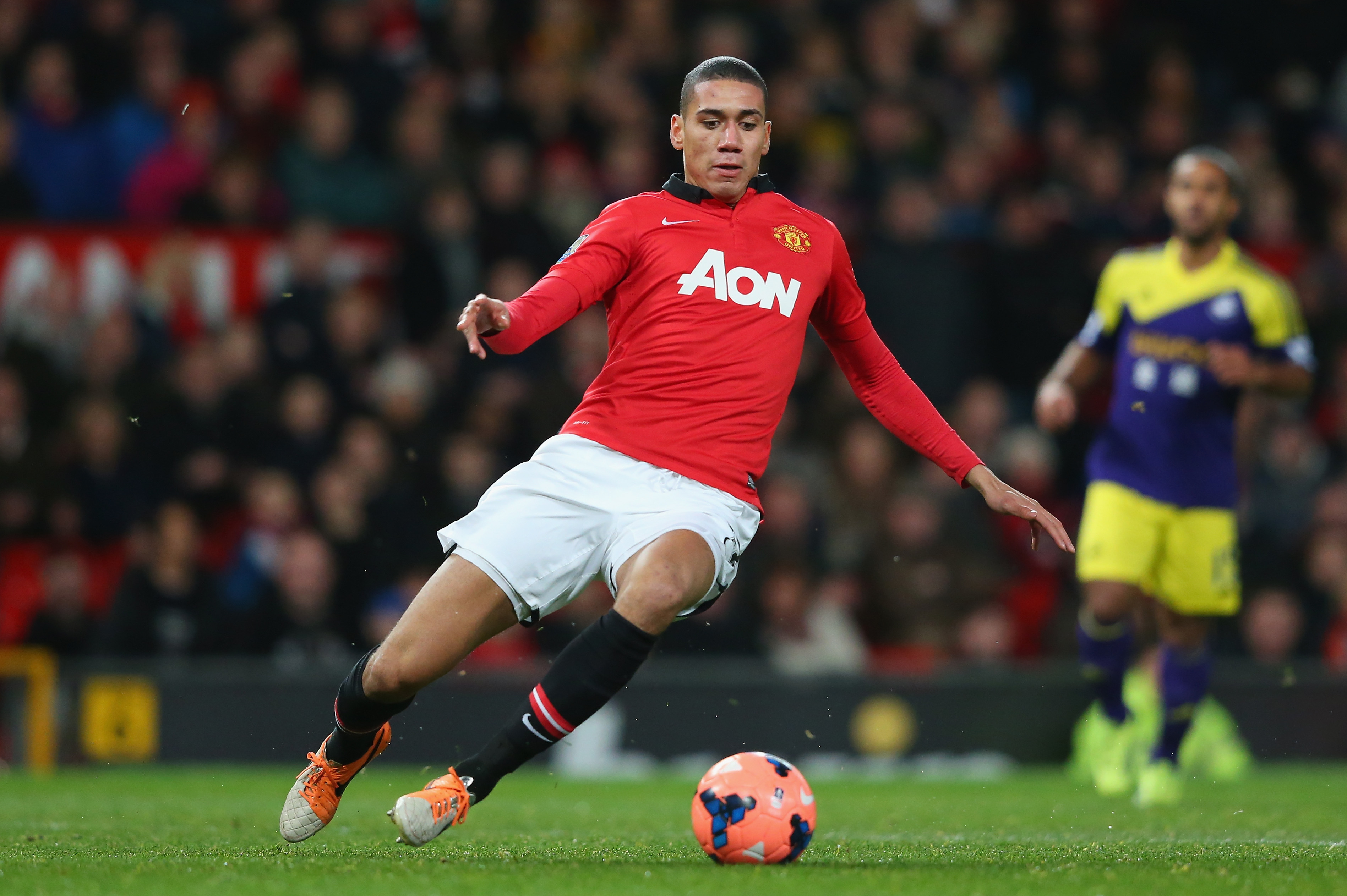 MANCHESTER, ENGLAND - JANUARY 05:  Chris Smalling of Manchester United in action during the FA Cup with Budweiser Third round match between Manchester United and Swansea City at Old Trafford on January 5, 2014 in Manchester, England.  (Photo by Alex Livesey/Getty Images)