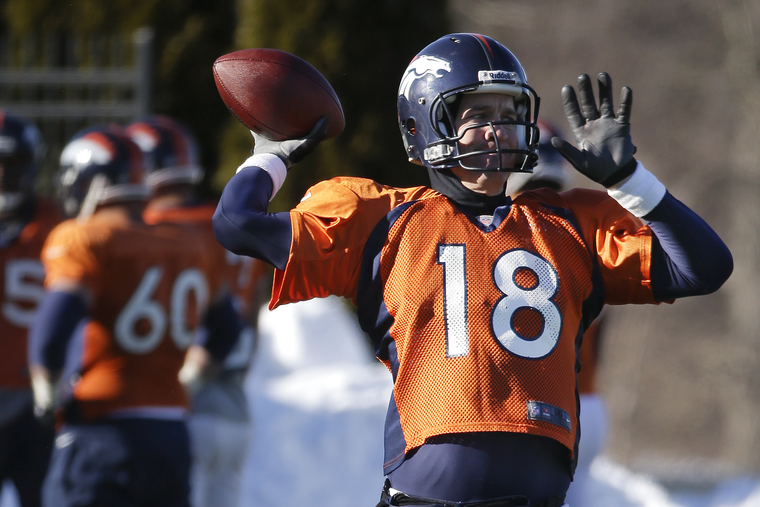 Denver Broncos quarterback Peyton Manning (18) passes during practice Wednesday, Jan. 29, 2014, in Florham Park, N.J. The Broncos are scheduled to play the Seattle Seahawks in the NFL Super Bowl XLVIII football game Sunday, Feb. 2, in East Rutherford, N.J. (AP Photo/Mark Humphrey)