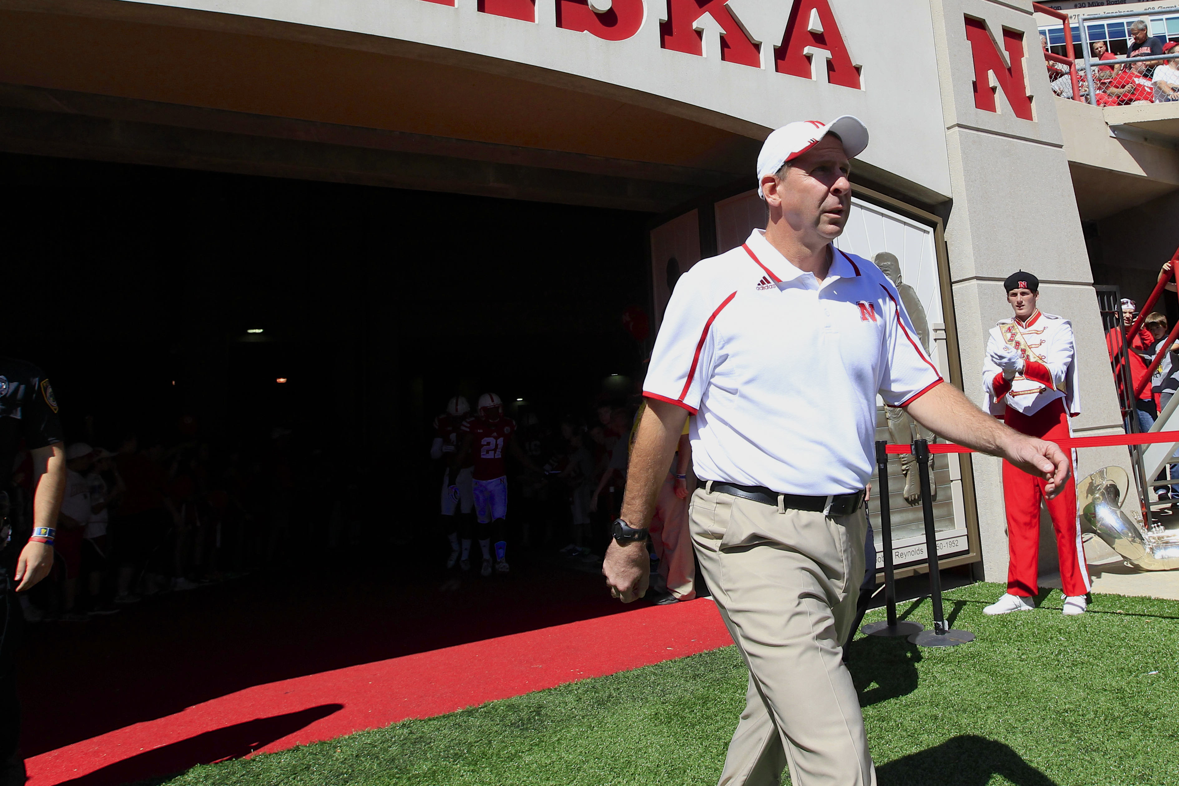 Nebraska head coach Bo Pelini walks onto the field during warmups prior to an NCAA college football game between South Dakota State and Nebraska in Lincoln, Neb., Saturday, Sept. 21, 2013. (AP Photo/Nati Harnik)
