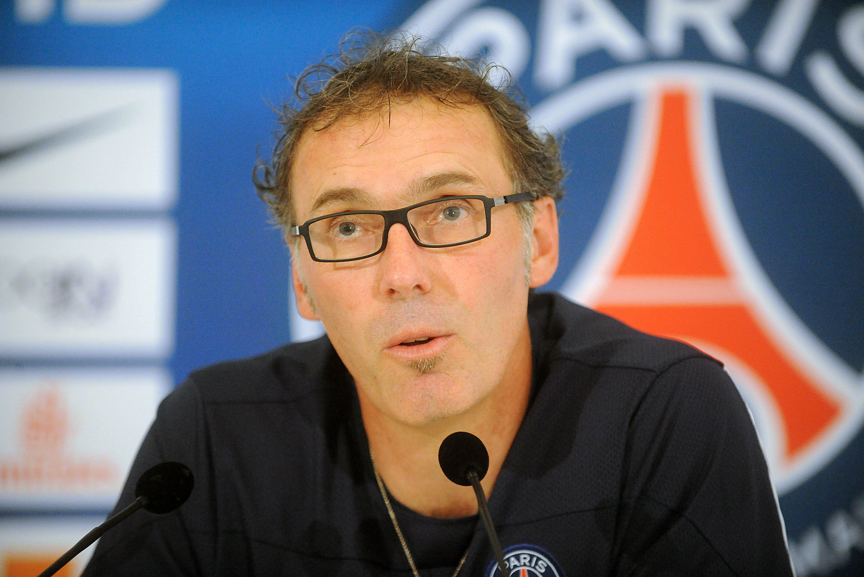 PARIS, FRANCE - JULY 19:  Paris Saint-Germain coach Laurent Blanc attends a press conference on July 19, 2013 in Clairefontaine, France.  (Photo by Antoine Antoniol/Getty Images)