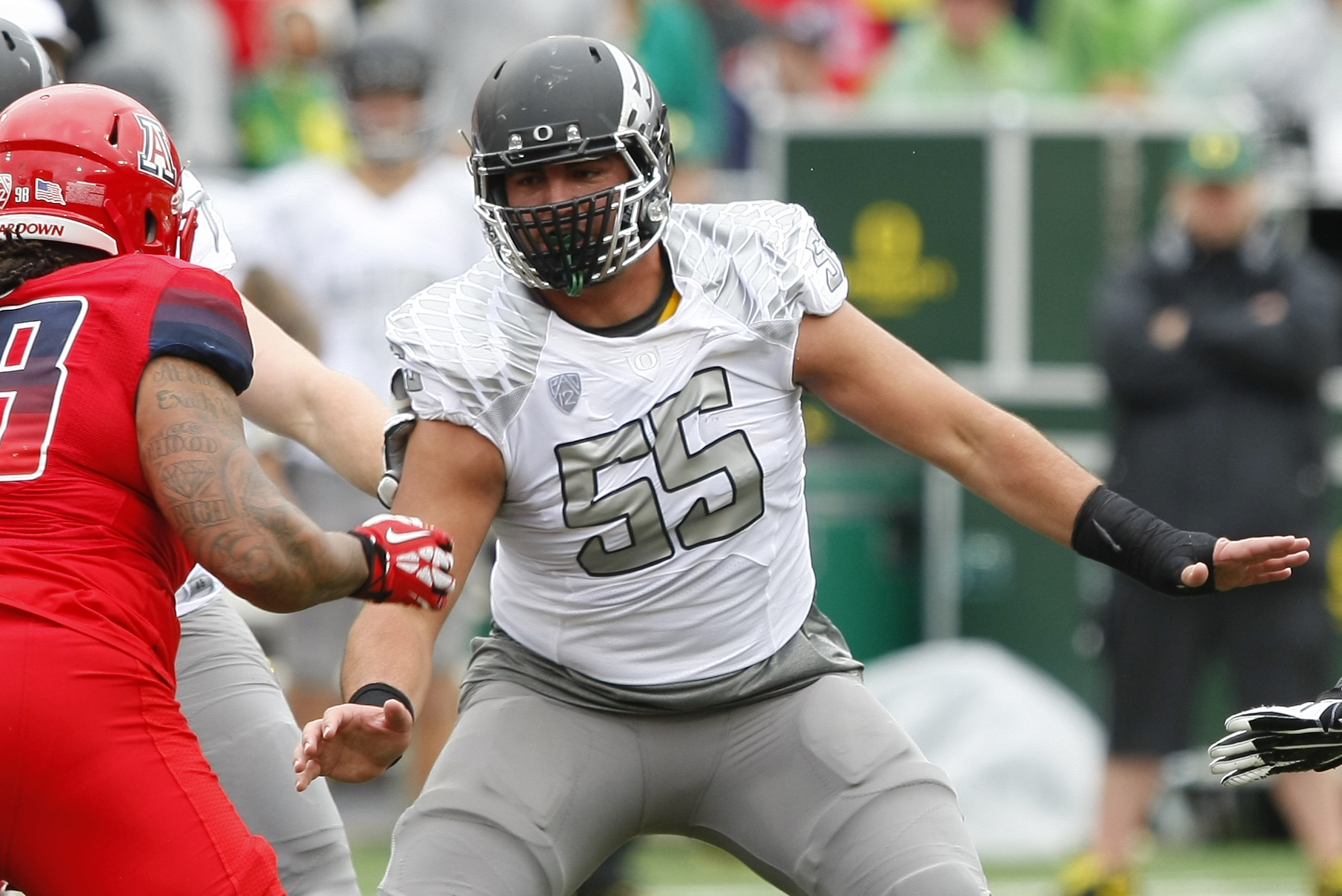 Oregon offensive linesman Hroniss Grasu (55) during the first half of an NCAA football game against Arizona, Saturday, Nov. 23, 2013, in Tucson, Ariz. (AP Photo/Rick Scuteri)