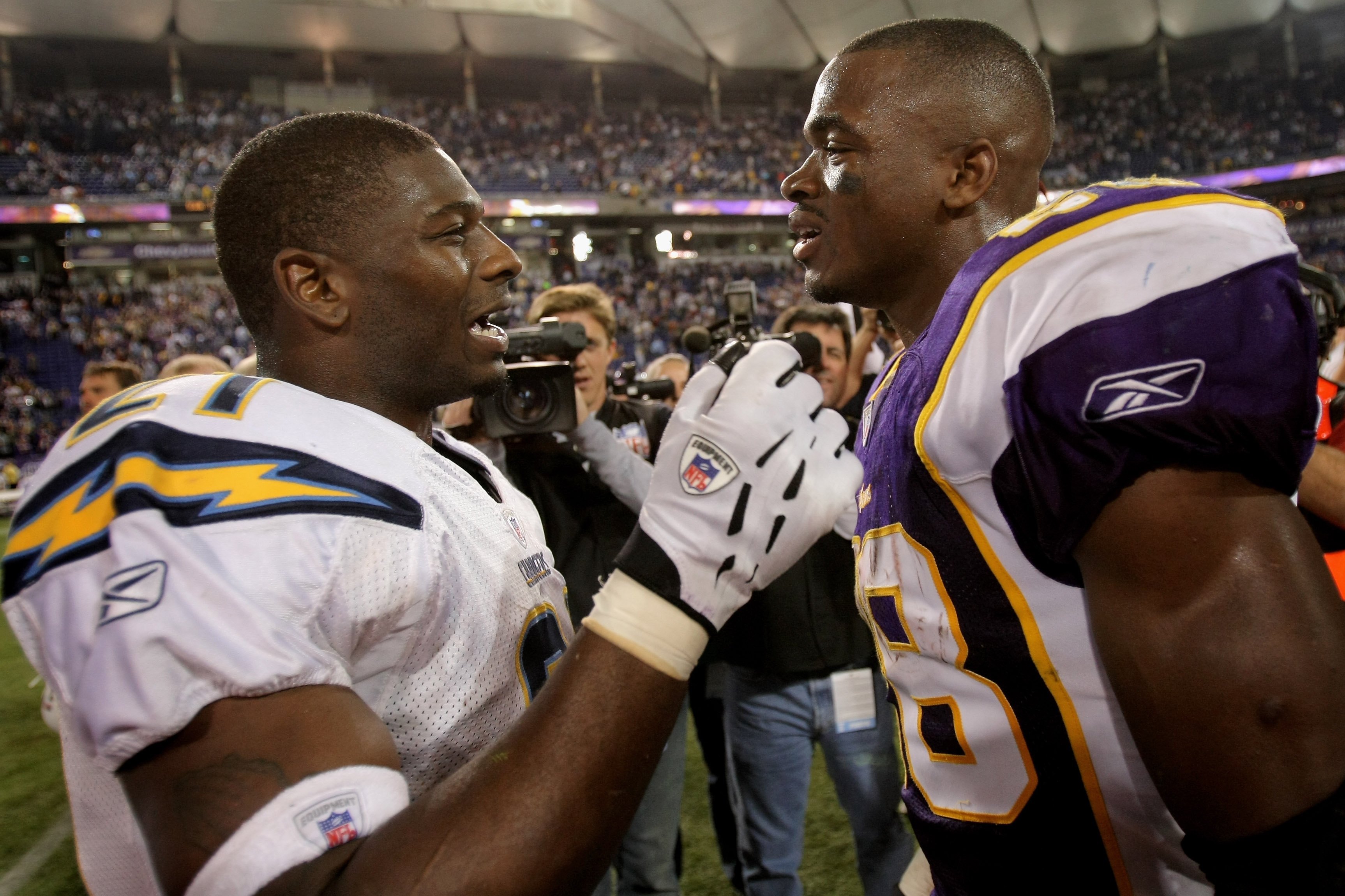 MINNEAPOLIS, MN - NOVEMBER 04:  LaDainian Tomlinson #21 of the San Diego Chargers and Adrian Peterson #28 of the Minnesota Vikings greet one another at midfield after the game at the Hubert H. Humphrey Metrodome on November 4, 2007 in Minneapolis, Minnesota. Tomlinson rushed for 40 yards in the game and Peterson rushed an NFL record setting 296 yards. The Vikings defeated the Chargers 35-17.  (Photo by Doug Pensinger/Getty Images)