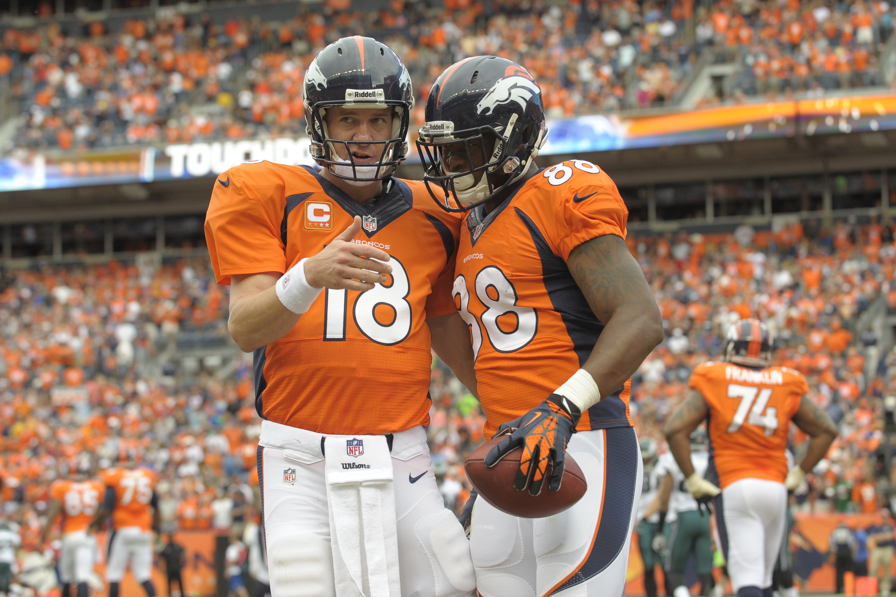 Denver Broncos quarterback Peyton Manning (18) congratulates Demaryius Thomas (88) after scoring a touchdown against the Philadelphia Eagles during an NFL football game, Sunday, Sept. 29, 2013, in Denver. (AP Photo/Jack Dempsey)