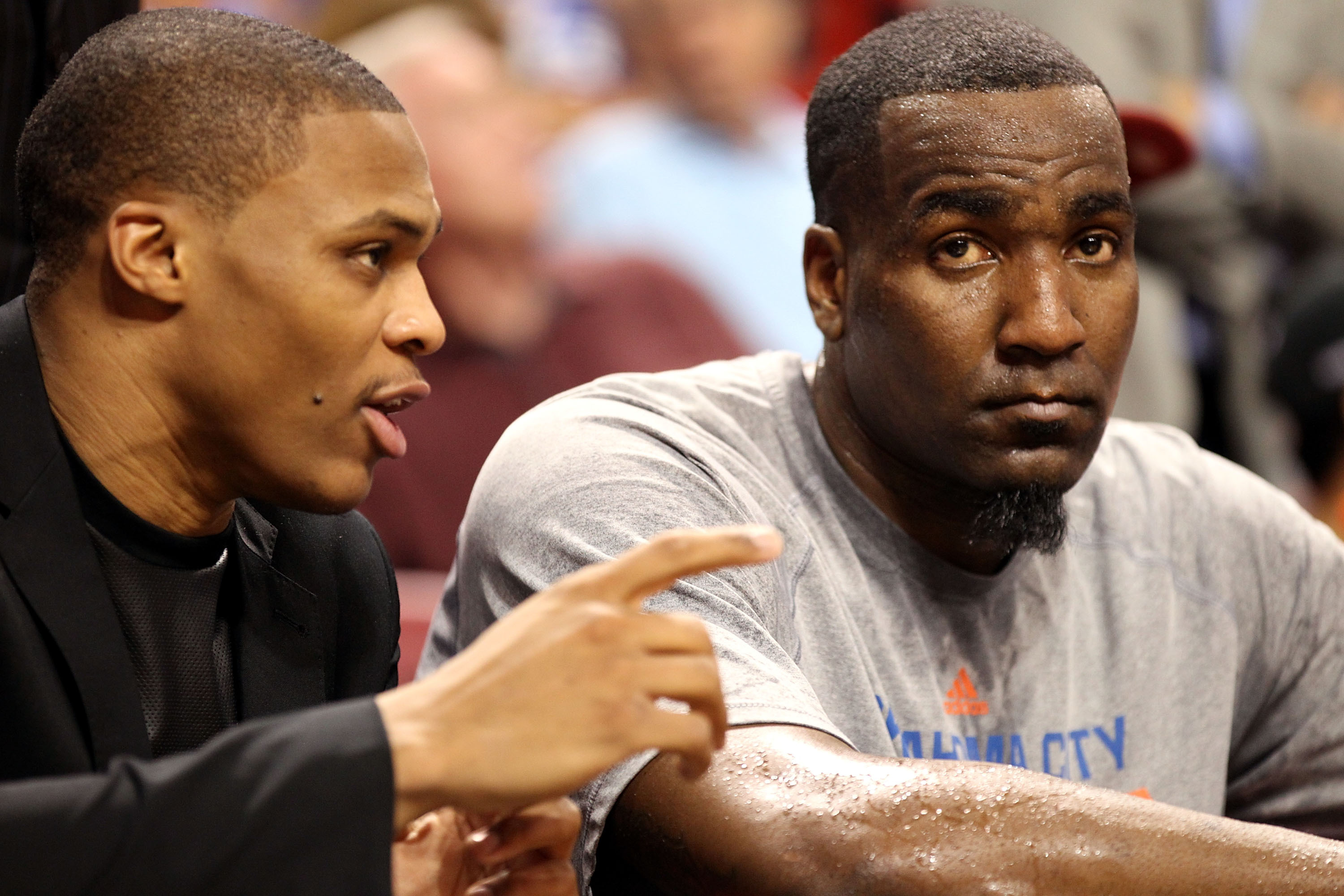 MIAMI, FL - JANUARY 29:  Guard Russell Westbrook #0  of the Oklahoma City Thunder chats with teammate Kendrick Perkins #5 during a game against  the Miami Heat at AmericanAirlines Arena on January 29, 2014 in Miami, Florida. The Thunder defeated the Heat 112-95. NOTE TO USER: User Expressly acknowledges and agrees that, by downloading and or using this photograph, user is consenting to the terms and conditions of the Getty Images Liscense Agreement.  (Photo by Marc Serota/Getty Images)