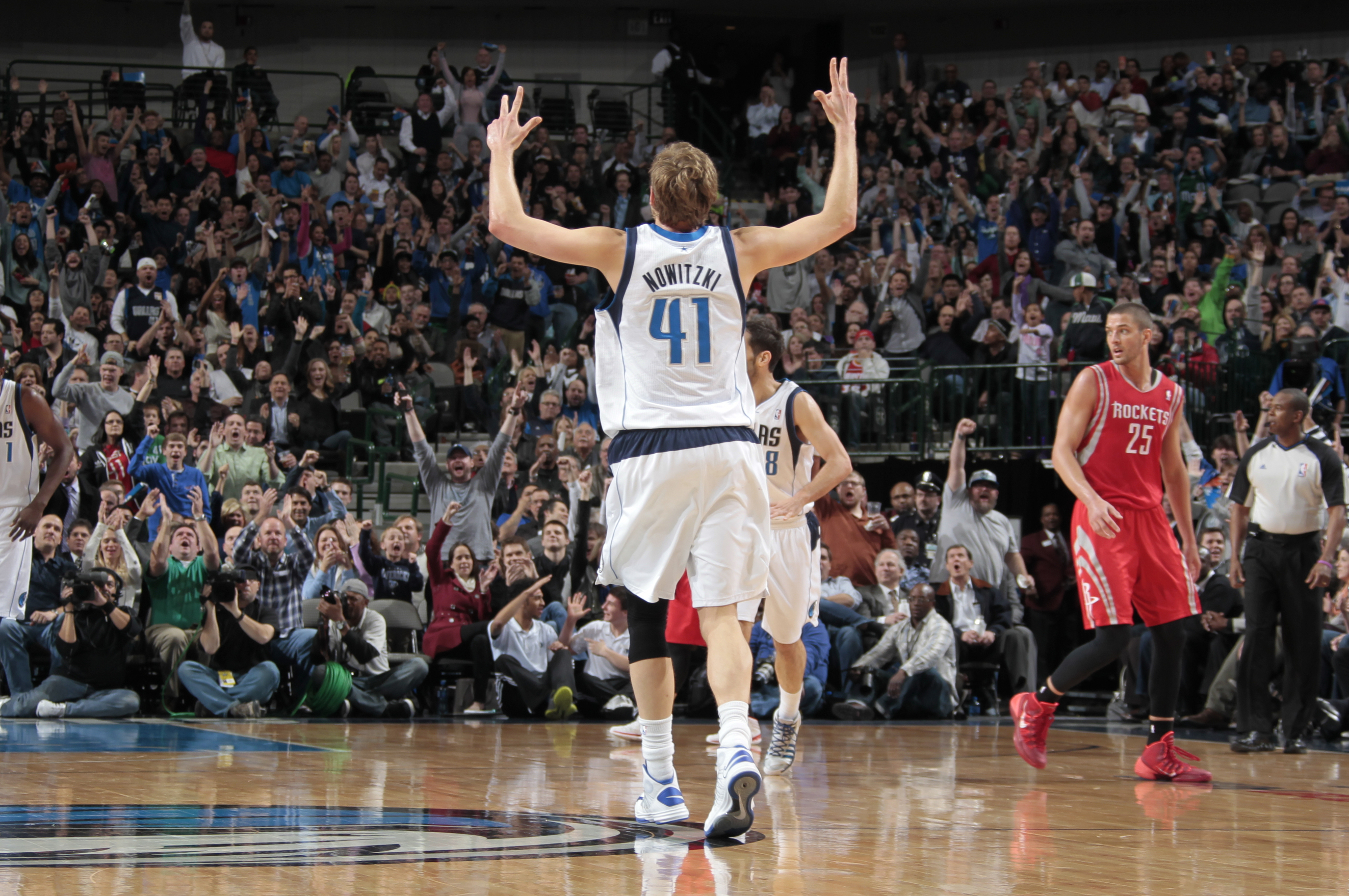 DALLAS, TX - JANUARY 29: Dirk Nowitzki #41 of the Dallas Mavericks celebrates against the Houston Rockets on January 29, 2014 at the American Airlines Center in Dallas, Texas. NOTE TO USER: User expressly acknowledges and agrees that, by downloading and or using this photograph, User is consenting to the terms and conditions of the Getty Images License Agreement. Mandatory Copyright Notice: Copyright 2014 NBAE (Photo by Danny Bollinger/NBAE via Getty Images)