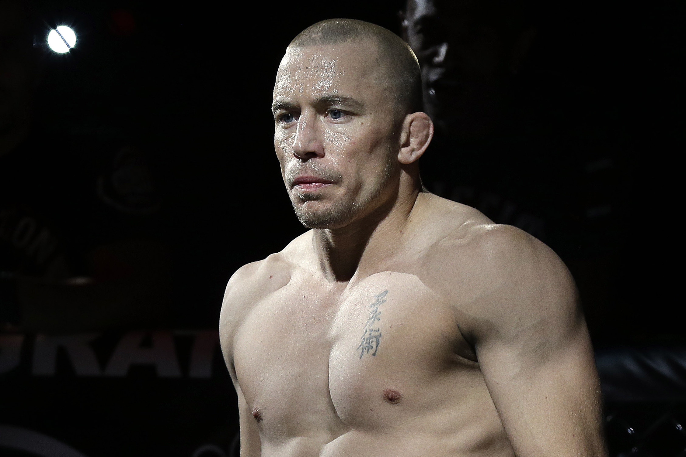 Georges St. Pierre, of Canada, waits to begin a UFC 167 mixed martial arts championship welterweight bout against Johny Hendricks on Saturday, Nov. 16, 2013, in Las Vegas. St. Pierre won by split decision. (AP Photo/Isaac Brekken)