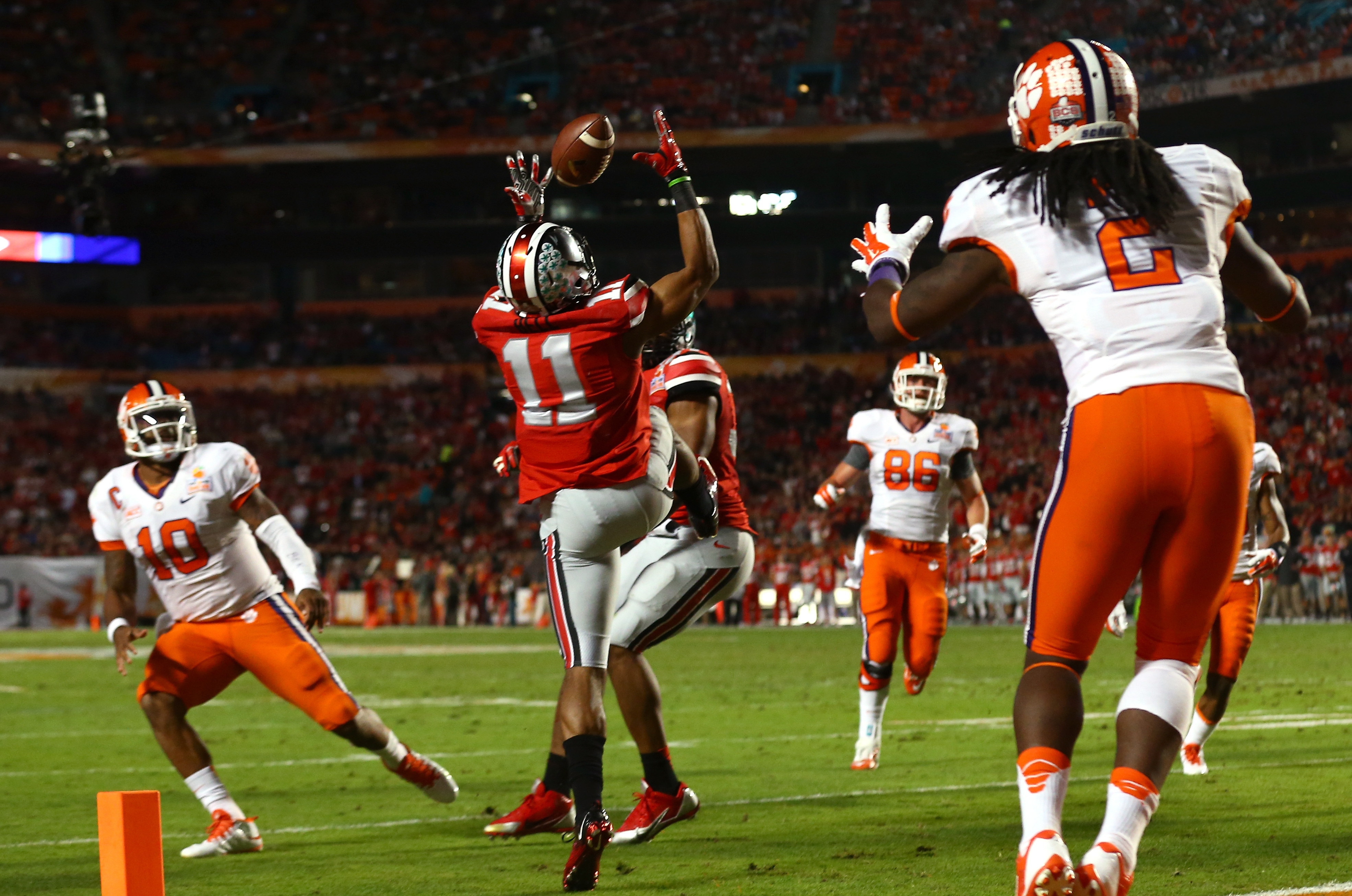 MIAMI GARDENS, FL - JANUARY 03:  Vonn Bell #11 of the Ohio State Buckeyes intercepts a pass thrown by Tajh Boyd #10 of the Clemson Tigers in the second quarter during the Discover Orange Bowl at Sun Life Stadium on January 3, 2014 in Miami Gardens, Florida.  (Photo by Streeter Lecka/Getty Images)