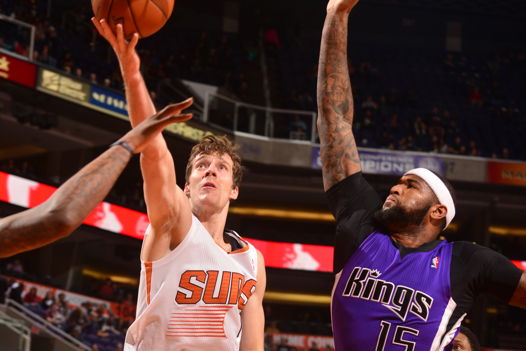 PHOENIX, AZ - DECEMBER 13: Goran Dragic #1 of the Phoenix Suns drives for a shot against DeMarcus Cousins #15 of the Sacramento Kings on December 13, 2013 at U.S. Airways Center in Phoenix, Arizona. NOTE TO USER: User expressly acknowledges and agrees that, by downloading and or using this photograph, user is consenting to the terms and conditions of the Getty Images License Agreement. Mandatory Copyright Notice: Copyright 2013 NBAE (Photo by Barry Gossage/NBAE via Getty Images)