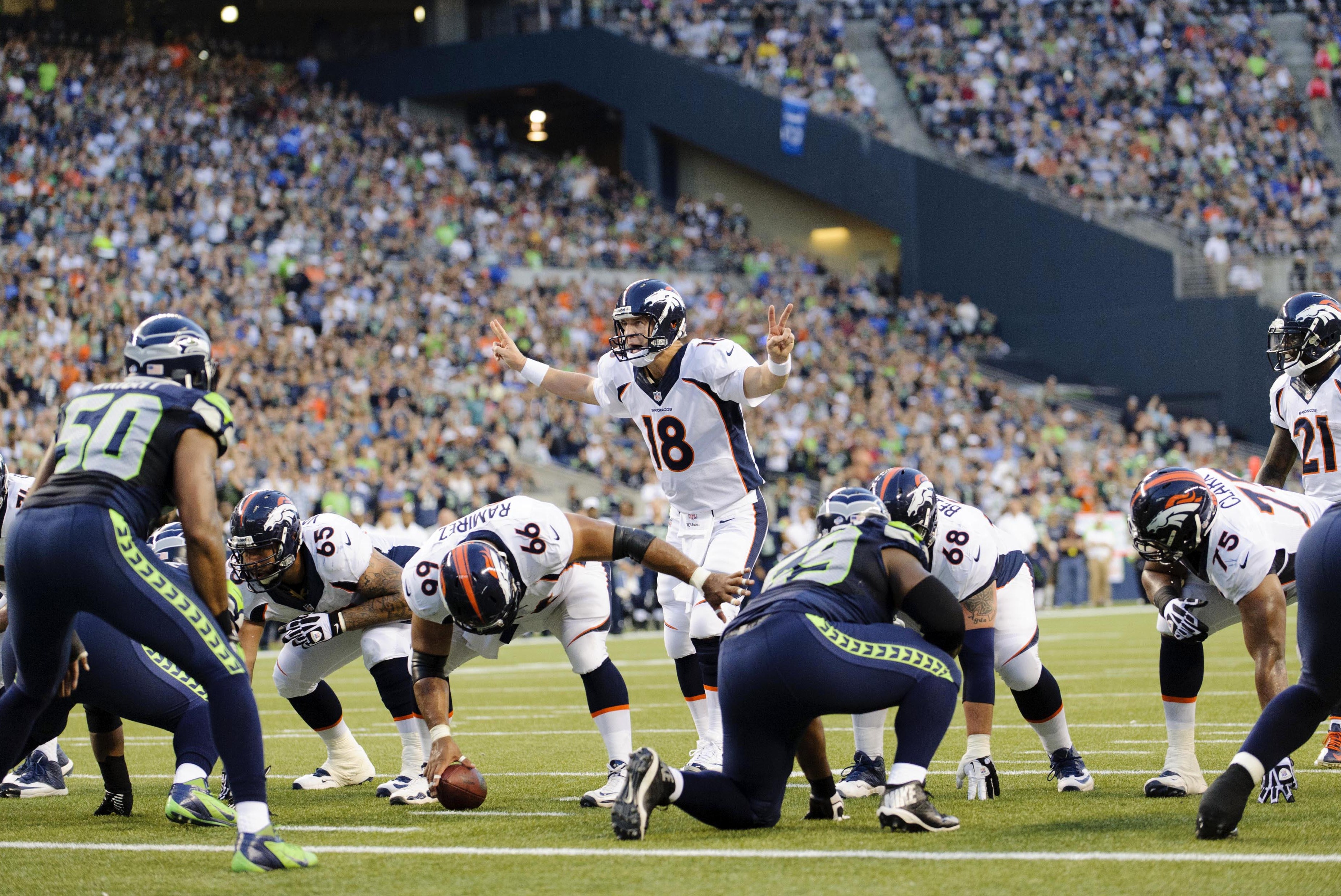 Aug 17, 2013; Seattle, WA, USA; Denver Broncos quarterback Peyton Manning (18) calls out an audible during the 1st half against the Seattle Seahawks at CenturyLink Field. Seattle defeated Denver 40-10. Mandatory Credit: Steven Bisig-USA TODAY Sports
