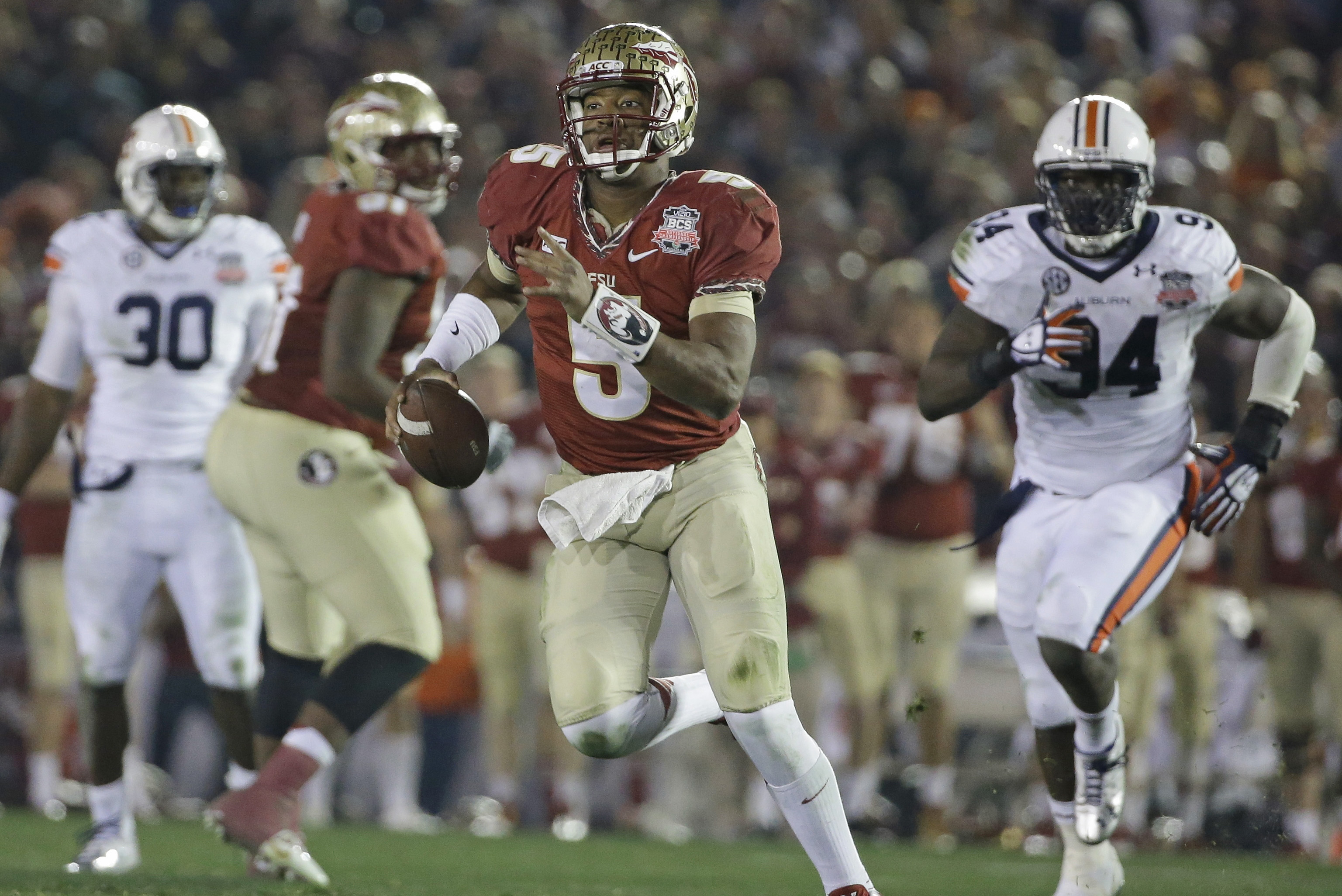 Florida State's Jameis Winston scrambles during the second half of the NCAA BCS National Championship college football game against Auburn Monday, Jan. 6, 2014, in Pasadena, Calif. (AP Photo/David J. Phillip)