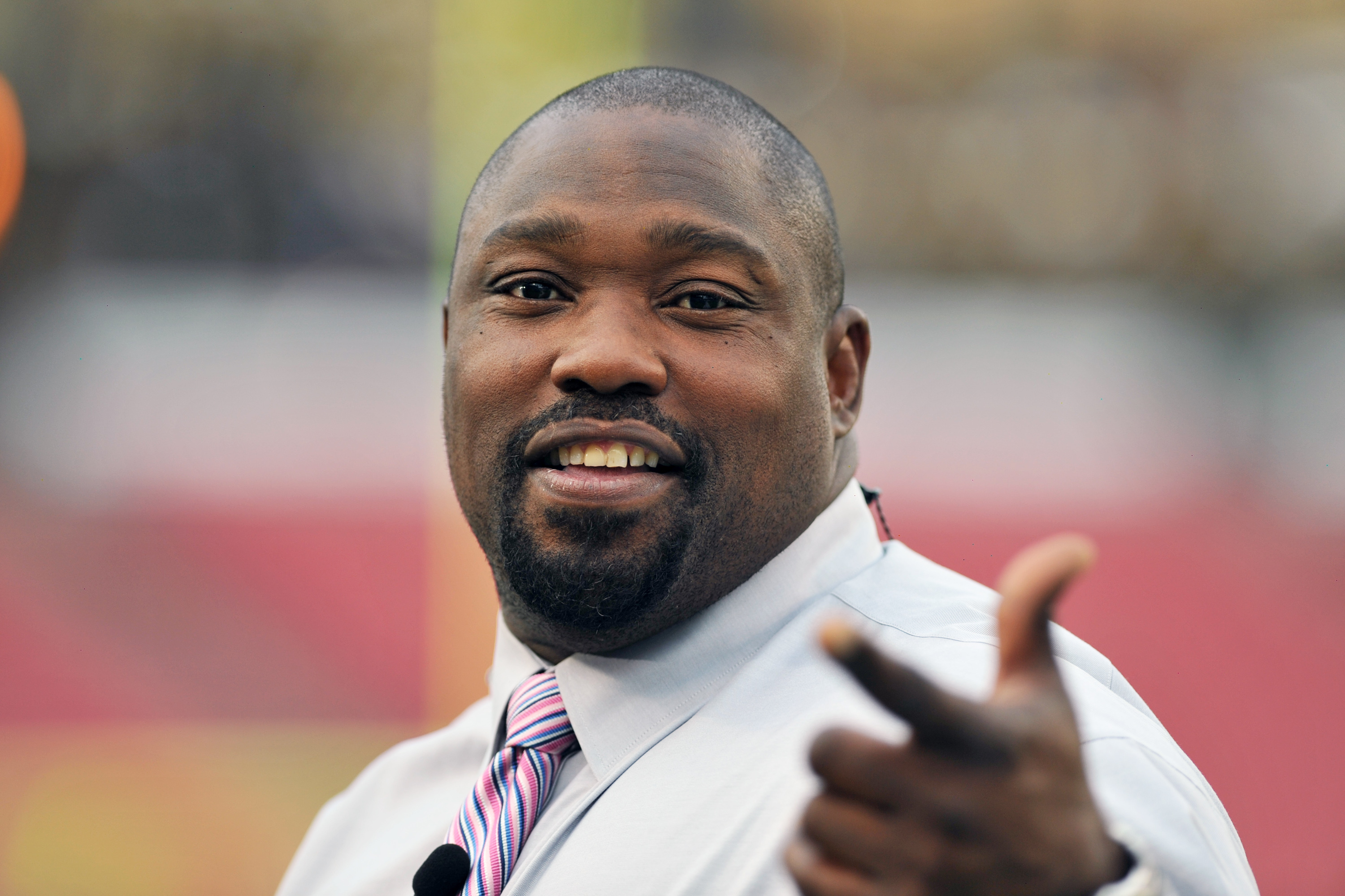TAMPA, FL - OCTOBER 24:  NFL television commentator Warren Sapp checks the field before the Tampa Bay Buccaneers play against the Carolina Panthers in a Thursday night football game October 24, 2013 at Raymond James Stadium in Tampa, Florida. (Photo by Al Messerschmidt/Getty Images)