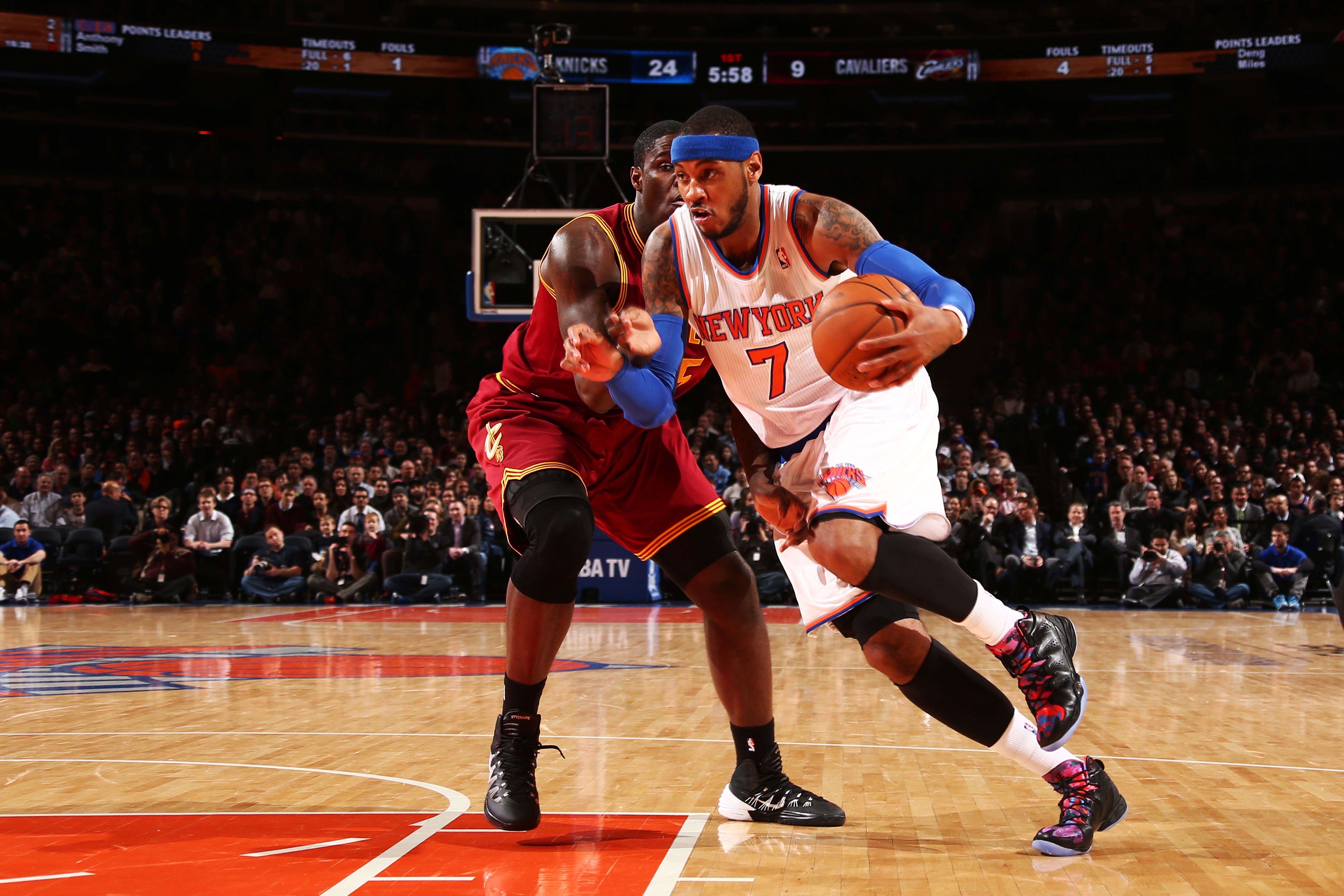 NEW YORK, NY - JANUARY 30: Carmelo Anthony #7 of the New York Knicks drives past Anthony Bennett #15 of the Cleveland Cavaliers during a game at Madison Square Garden in New York City on January 30, 2014.  NOTE TO USER: User expressly acknowledges and agrees that, by downloading and or using this photograph, User is consenting to the terms and conditions of the Getty Images License Agreement. Mandatory Copyright Notice: Copyright 2014 NBAE  (Photo by Nathaniel S. Butler/NBAE via Getty Images)