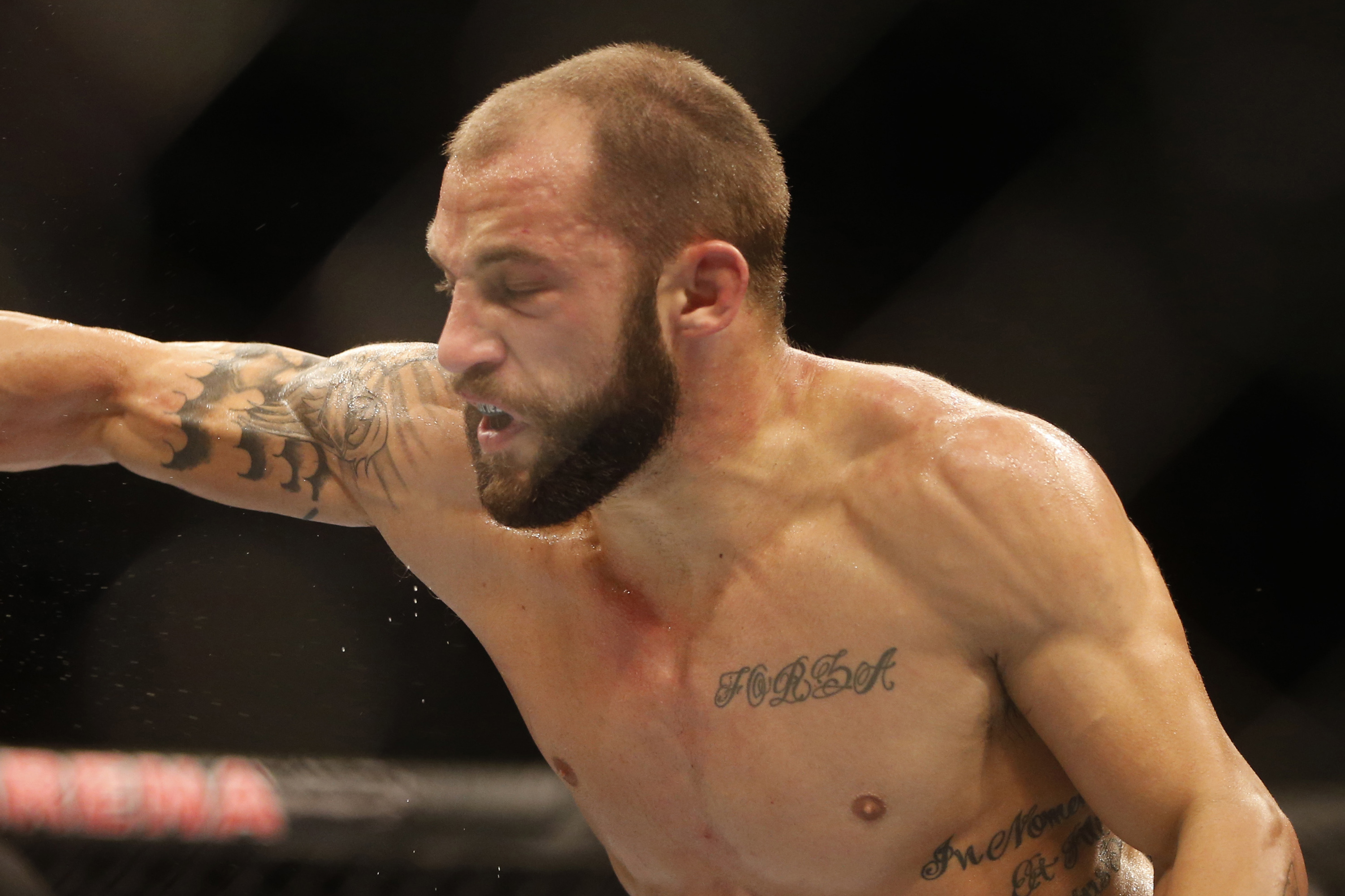 Sam Sicilia, right, from the U.S., fights Rony Mariano Bezzerra, from Brazil, during their featherweight mixed martial arts bout at the Ultimate Fighting Championship (UFC) 153 in Rio de Janeiro, Brazil, Saturday Oct.  13, 2012. Bezzerra defeated Sicilia. (AP Photo/Felipe Dana)