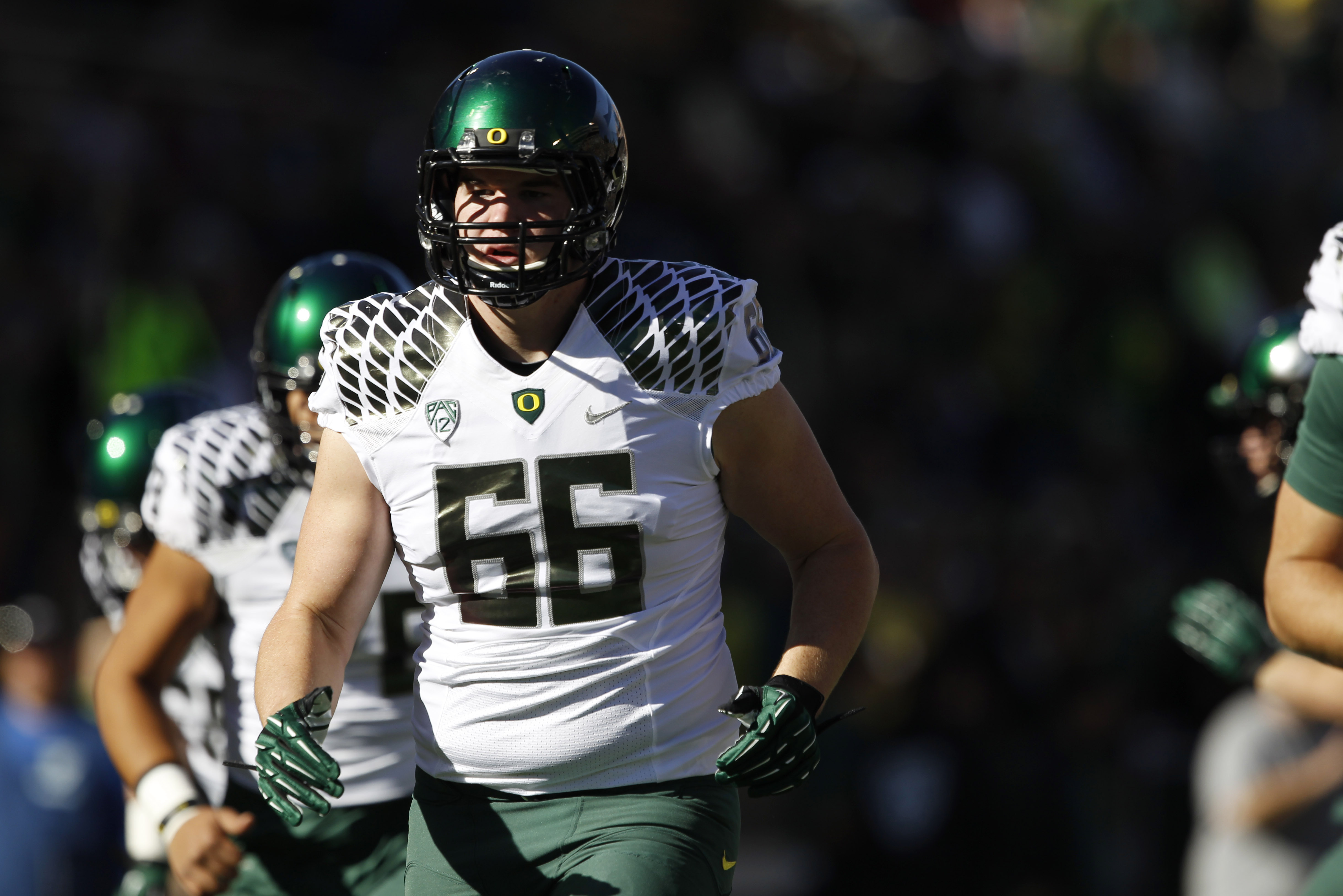 Oregon defensive end Taylor Hart warms up before facing Colorado in the first quarter of an NCAA college football game in Boulder, Colo., on Saturday, Oct. 5, 2013. (AP Photo/David Zalubowski)