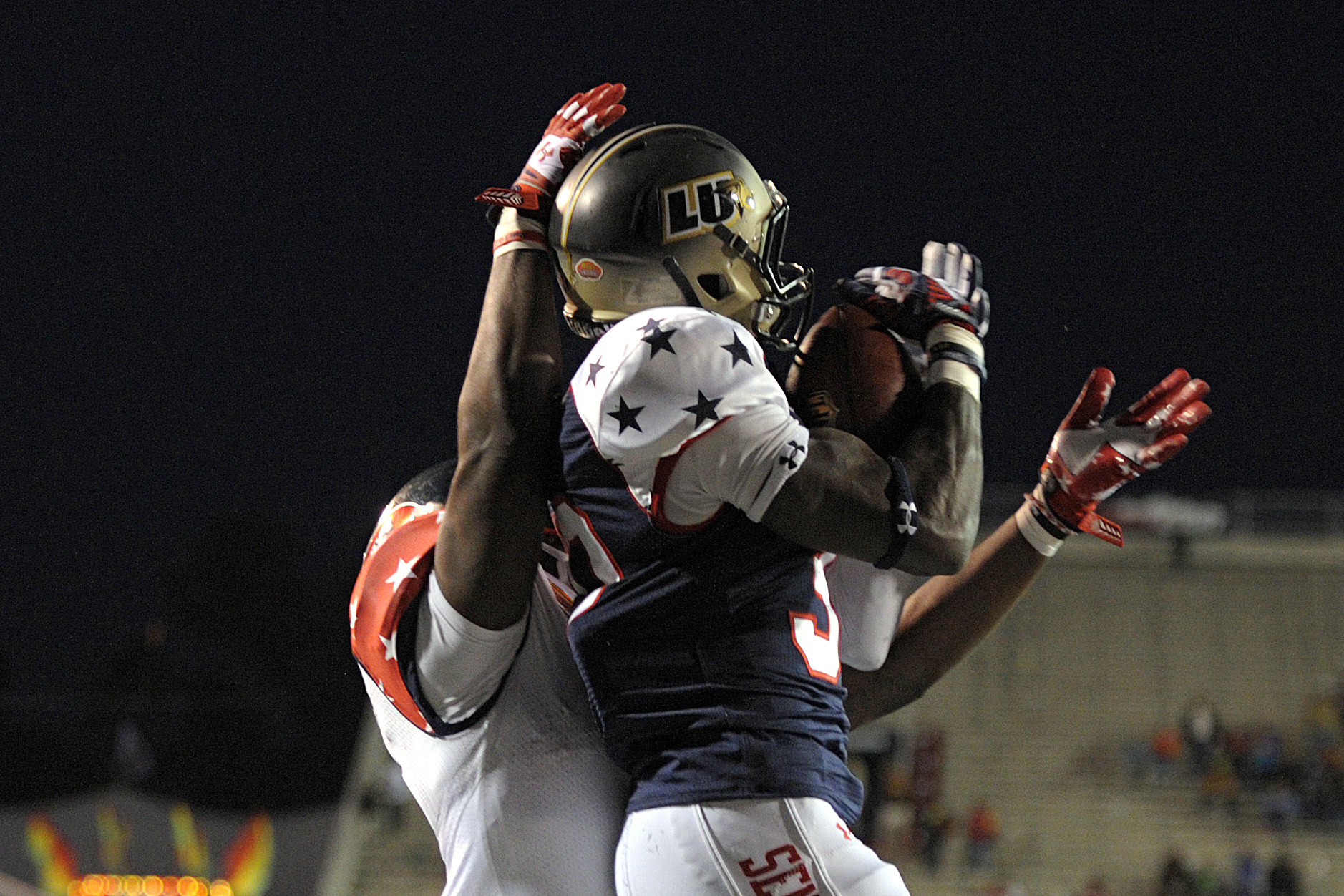 North defensive corner Pierre Desir (30), of Lindenwood, intercepts a pass in front of South running back Antonio Andrews (5), of Western Kentucky, in the end zone during the second half of the Senior Bowl NCAA college football game on Saturday, Jan. 25, 2014, in Mobile, Ala. The South won 20-10. (AP Photo/G.M. Andrews)
