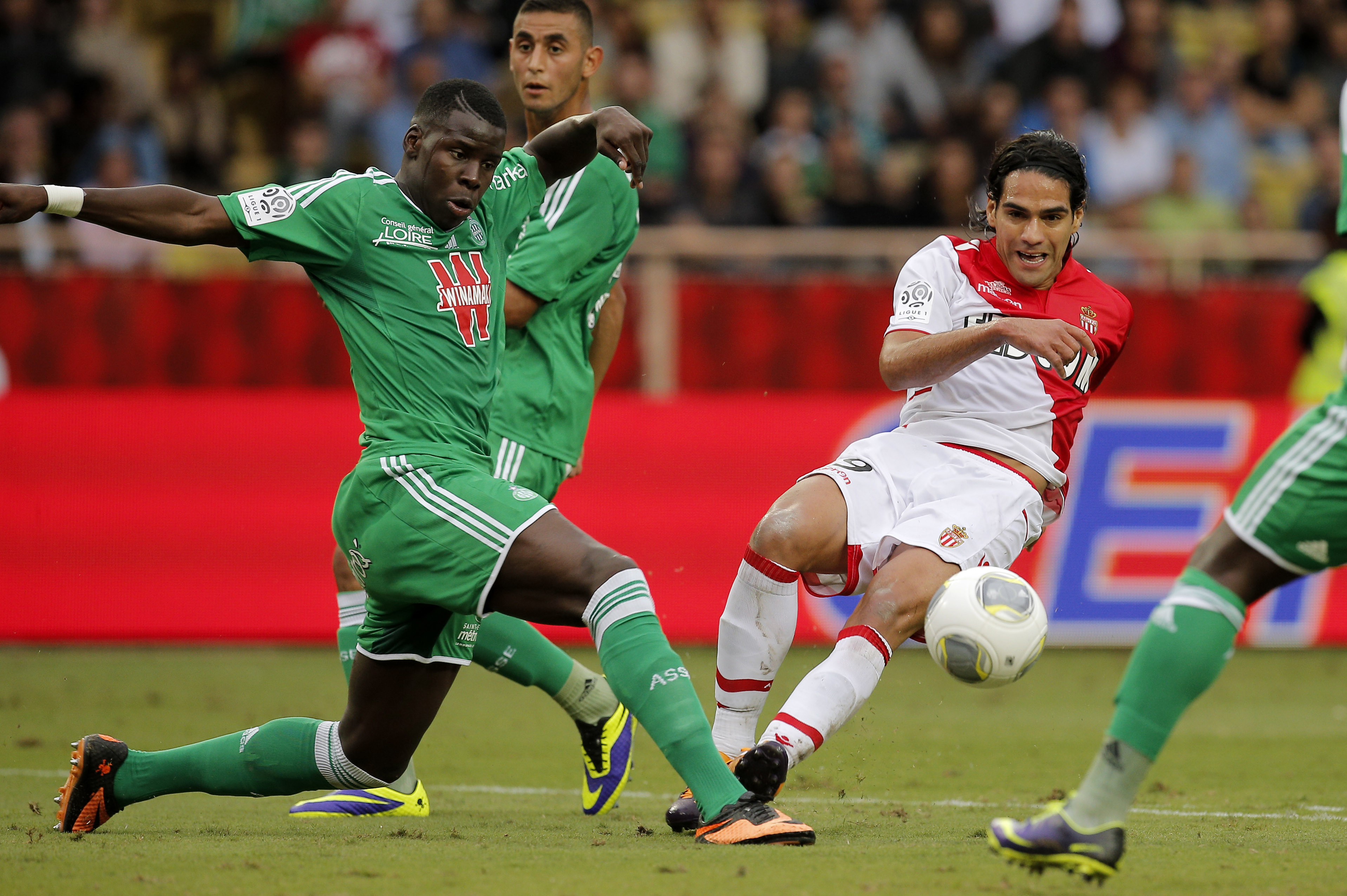 Monaco's Falcao, right, challenges for the ball with Saint Etienne's Kurt Zouma during their French League One soccer match at the Monaco stadium, Monaco, Saturday, Oct. 5, 2013. (AP Photo/Lionel Cironneau)