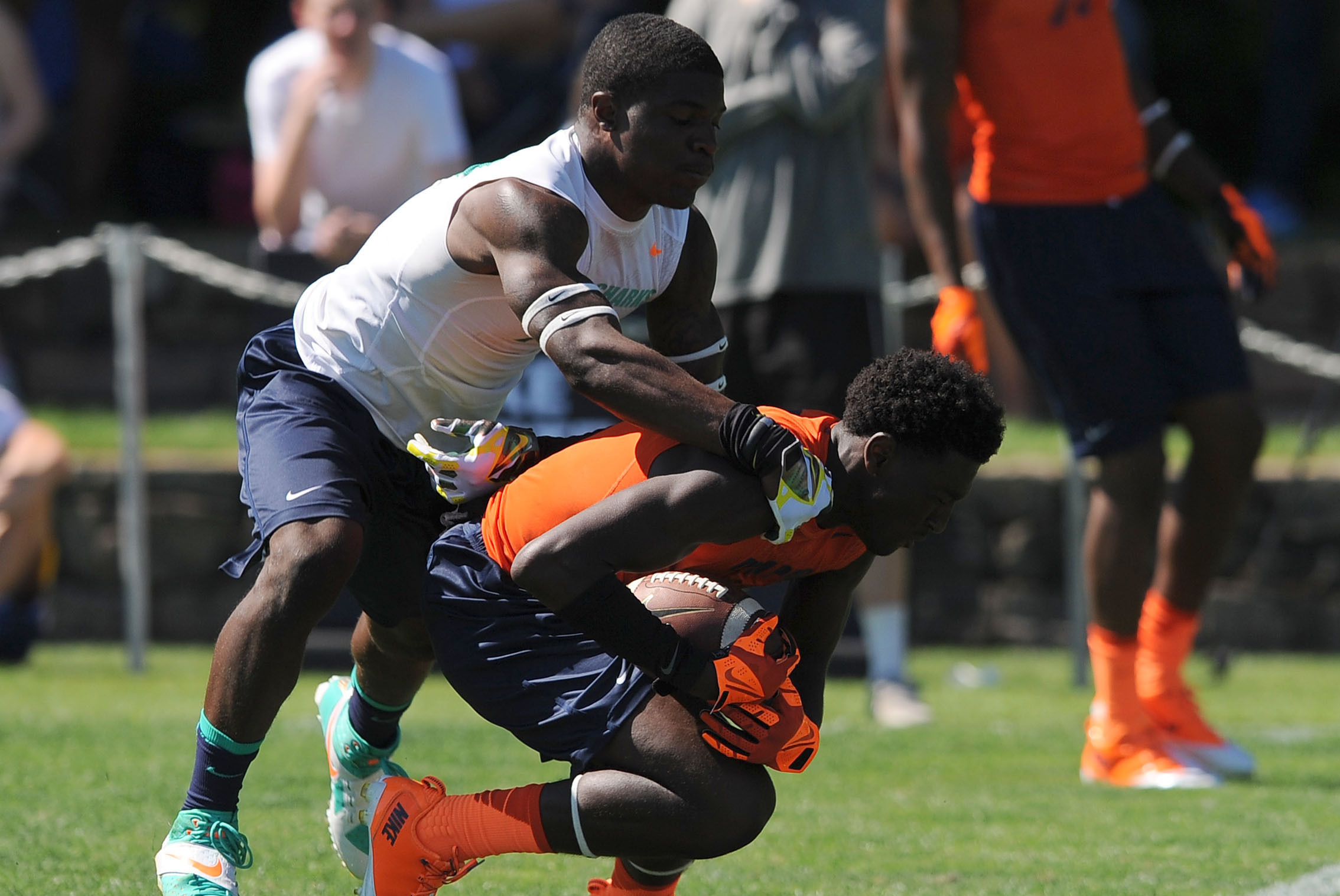 Jul 3, 2013; Beaverton, OR, USA; Cornerback Arrion Springs (10) tackles athlete Paris Campbell (12) during the Nike 7on7 elimination play at Nike World Headquarters. Mandatory Credit: Steve Dykes-USA TODAY Sports