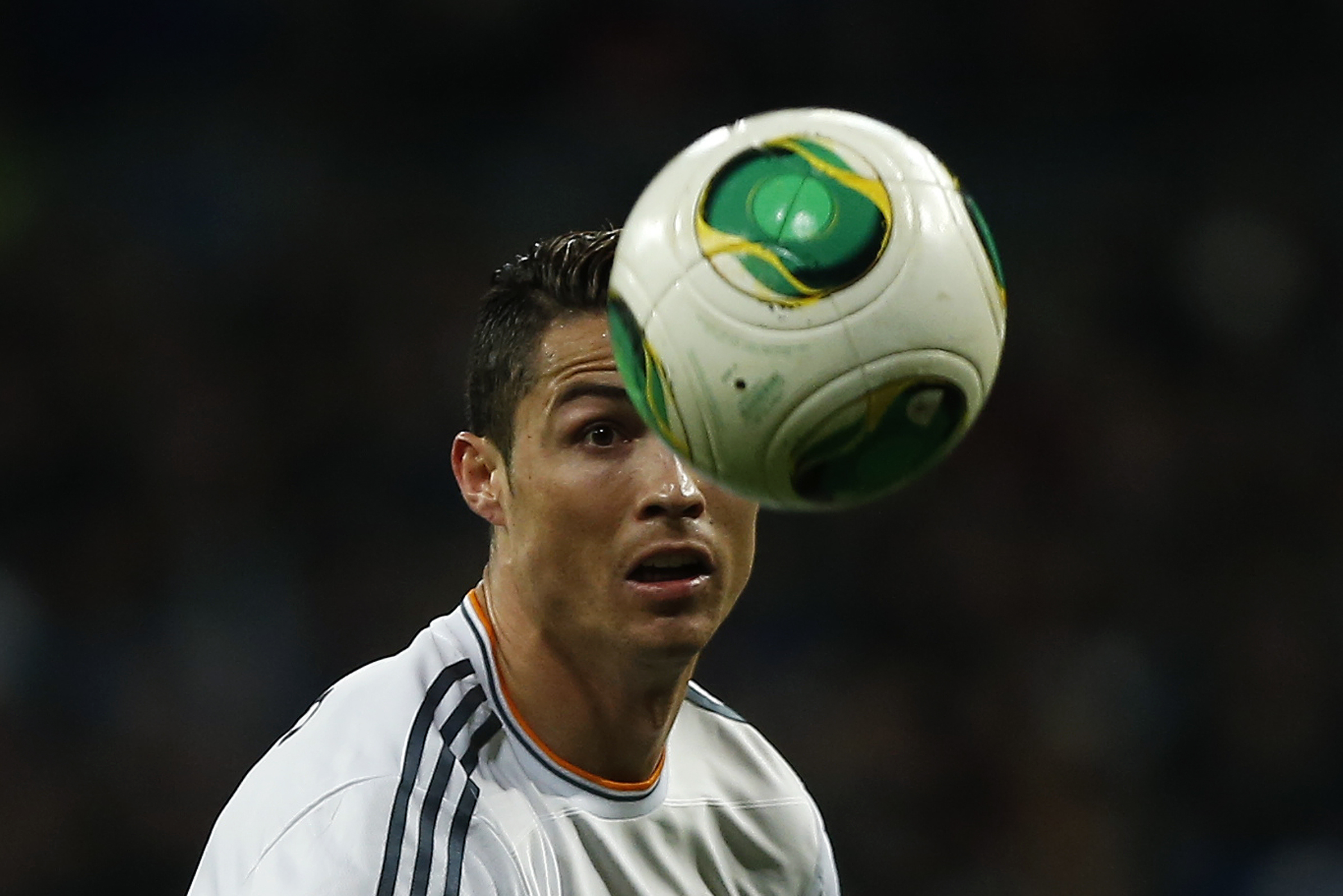 Real Madrid's Cristiano Ronaldo from Portugal runs after the ball during a Copa del Rey soccer match between Real Madrid and Espanyol at the Santiago Bernabeu stadium in Madrid, Spain, Tuesday, Jan. 28, 2014. (AP Photo/Andres Kudacki)