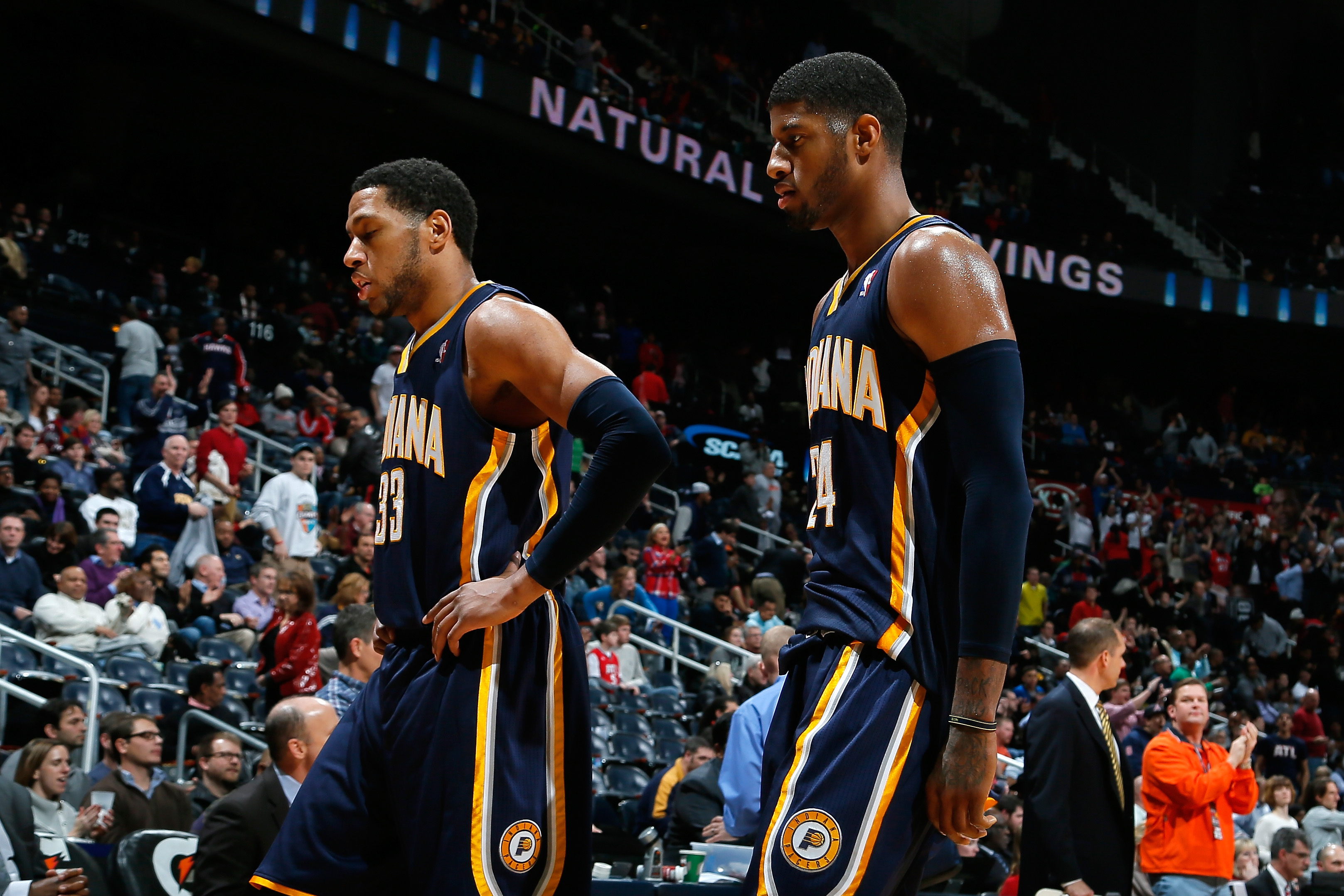 ATLANTA, GA - JANUARY 08:  Danny Granger #33 and Paul George #24 of the Indiana Pacers walk off the court after their 97-87 loss to the Atlanta Hawks at Philips Arena on January 8, 2014 in Atlanta, Georgia.  NOTE TO USER: User expressly acknowledges and agrees that, by downloading and or using this photograph, User is consenting to the terms and conditions of the Getty Images License Agreement.  (Photo by Kevin C. Cox/Getty Images)