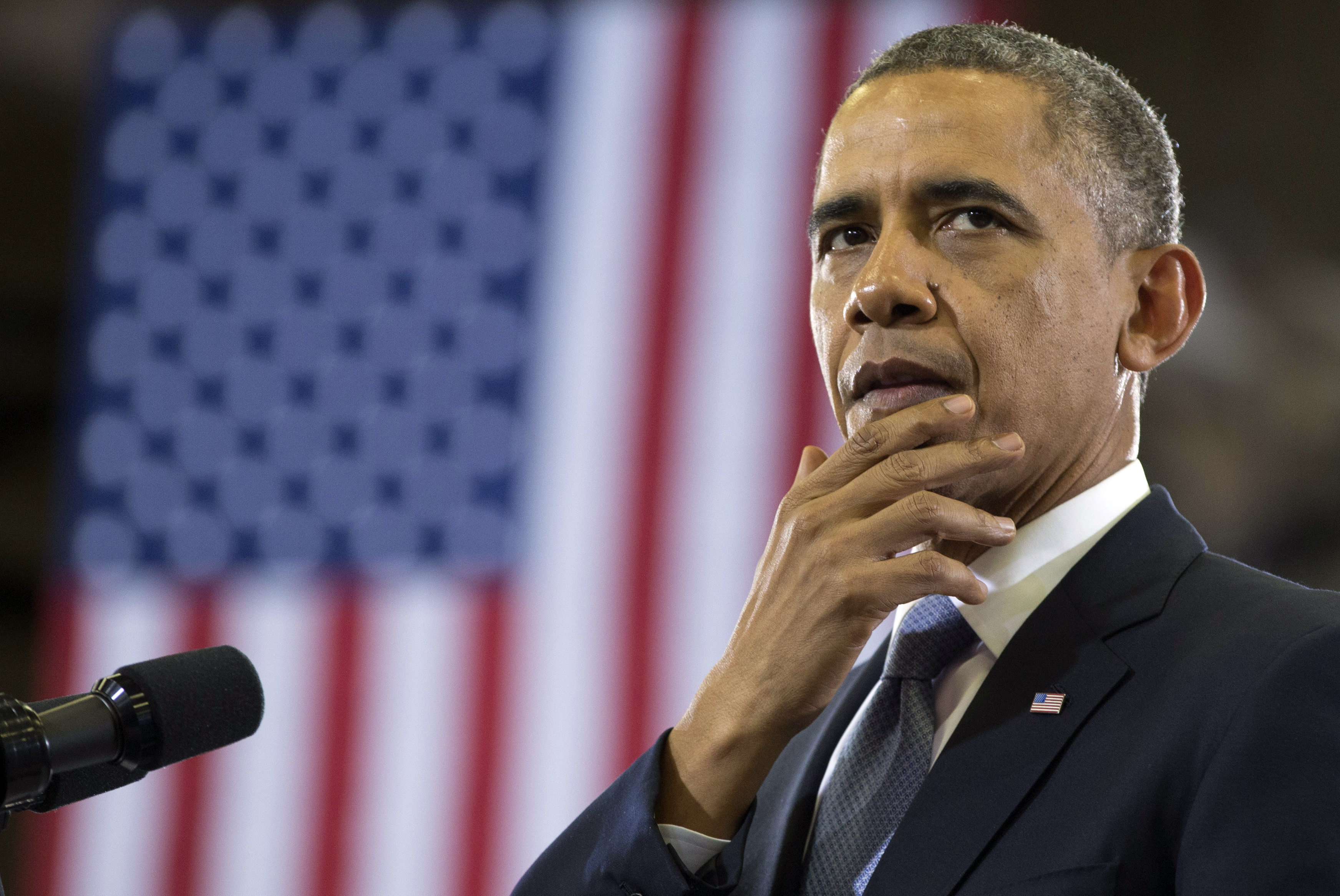 President Barack Obama pauses as he speaks at McGavock High School, Thursday, Jan. 30, 2014, in Nashville, Tenn., about education. President Obama also talked about a fatal shooting  involving two students at the school earlier this week. This trip is part of a four-stop tour President Barack Obama is making to expand on themes from his State of the Union address. (AP Photo)